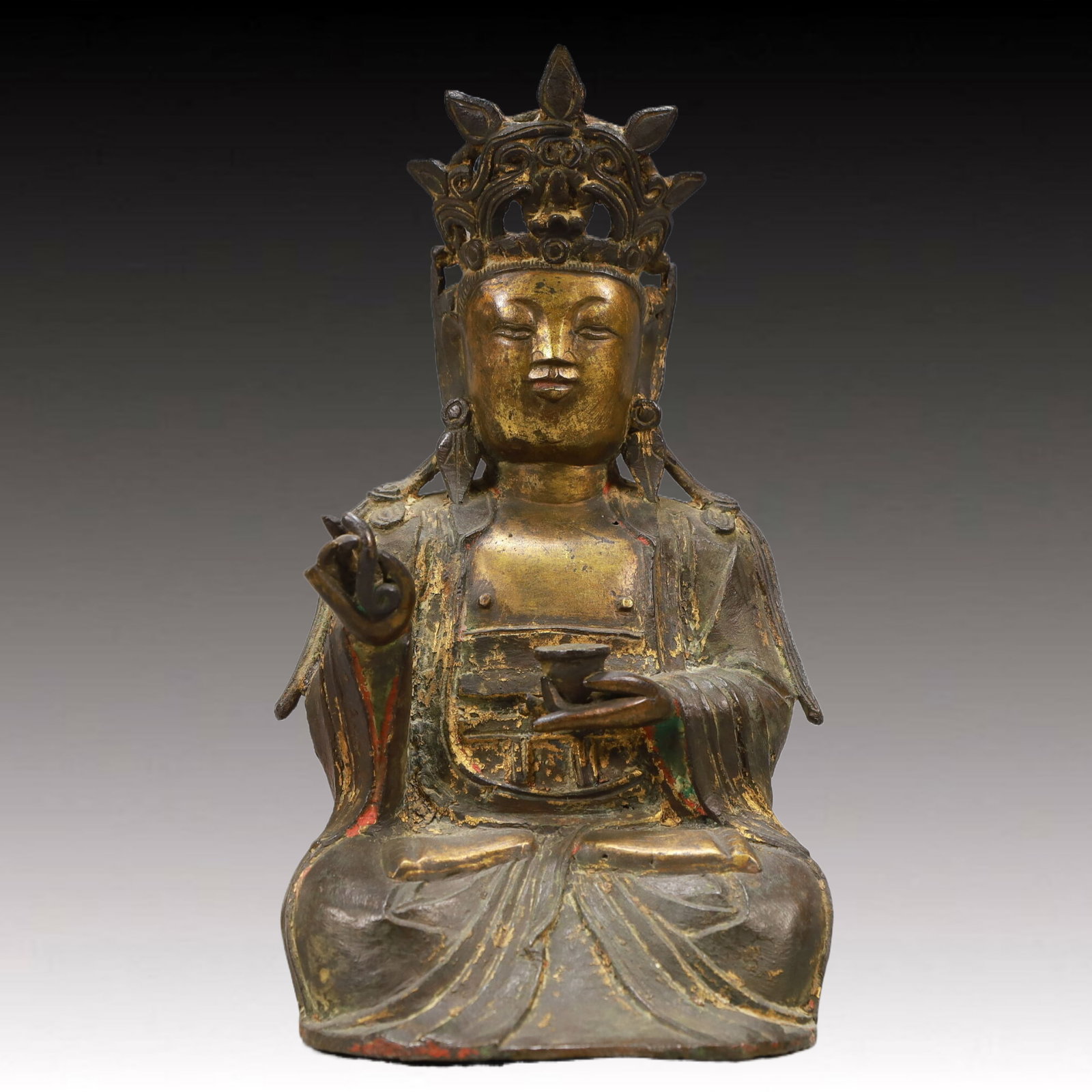An Excellent Gilt-Bronze Figure Of Guanyin: Estimated Value:4800-9600 An Excellent Gilt-Bronze Figure Of Guanyin. Seated,body rendered clad in long,flowing robes,the voluminous drapery elegantly cascading in folds. Chinese Ming Dynasty.
