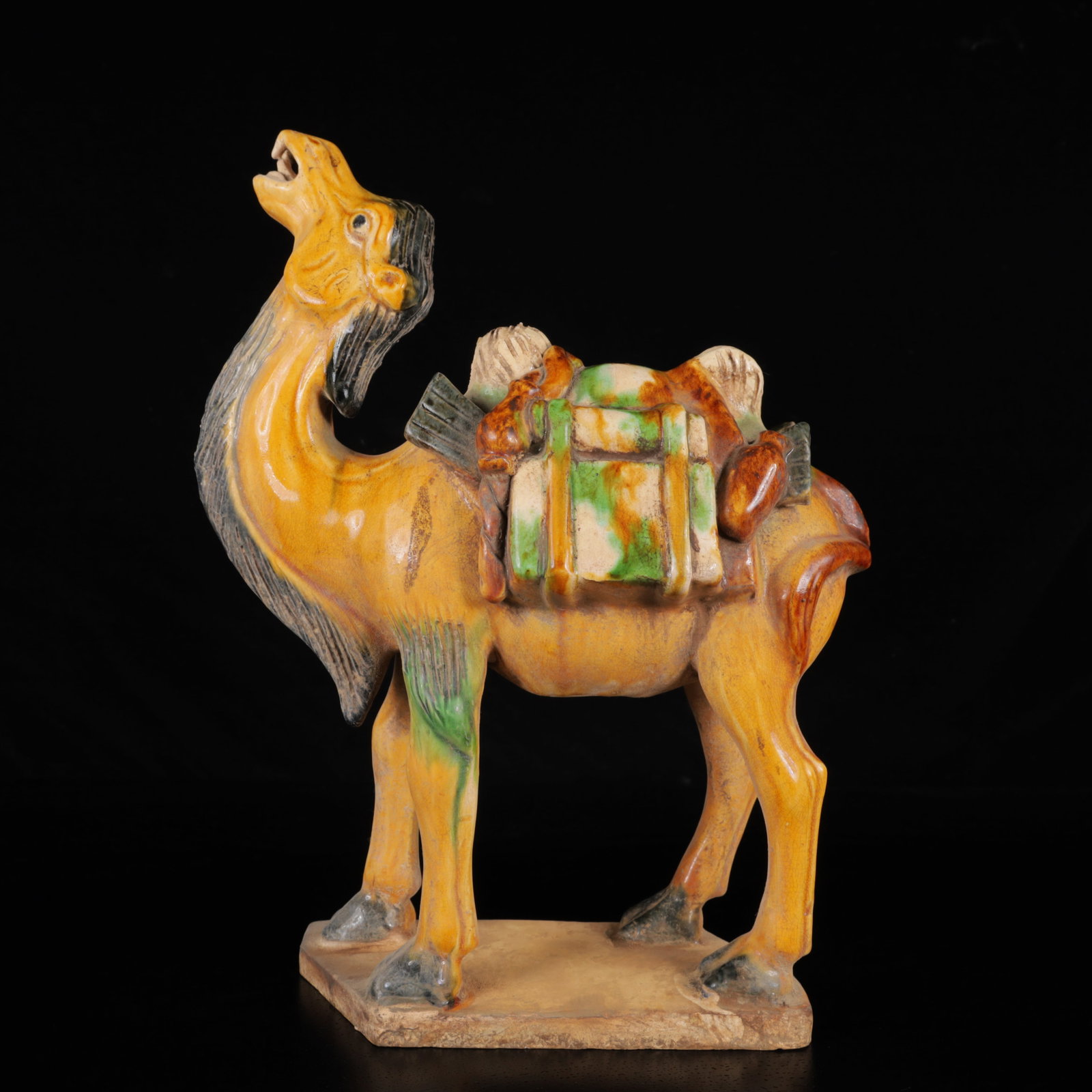 An Exquisite Tang Tri-Color Glazed Pottery Camel Ornament: An Exquisite Tang Tri-Color Glazed Pottery Camel Ornament,Tang Dynasty,China,Size:8.3inx3.5inx11in,Weight:1360g