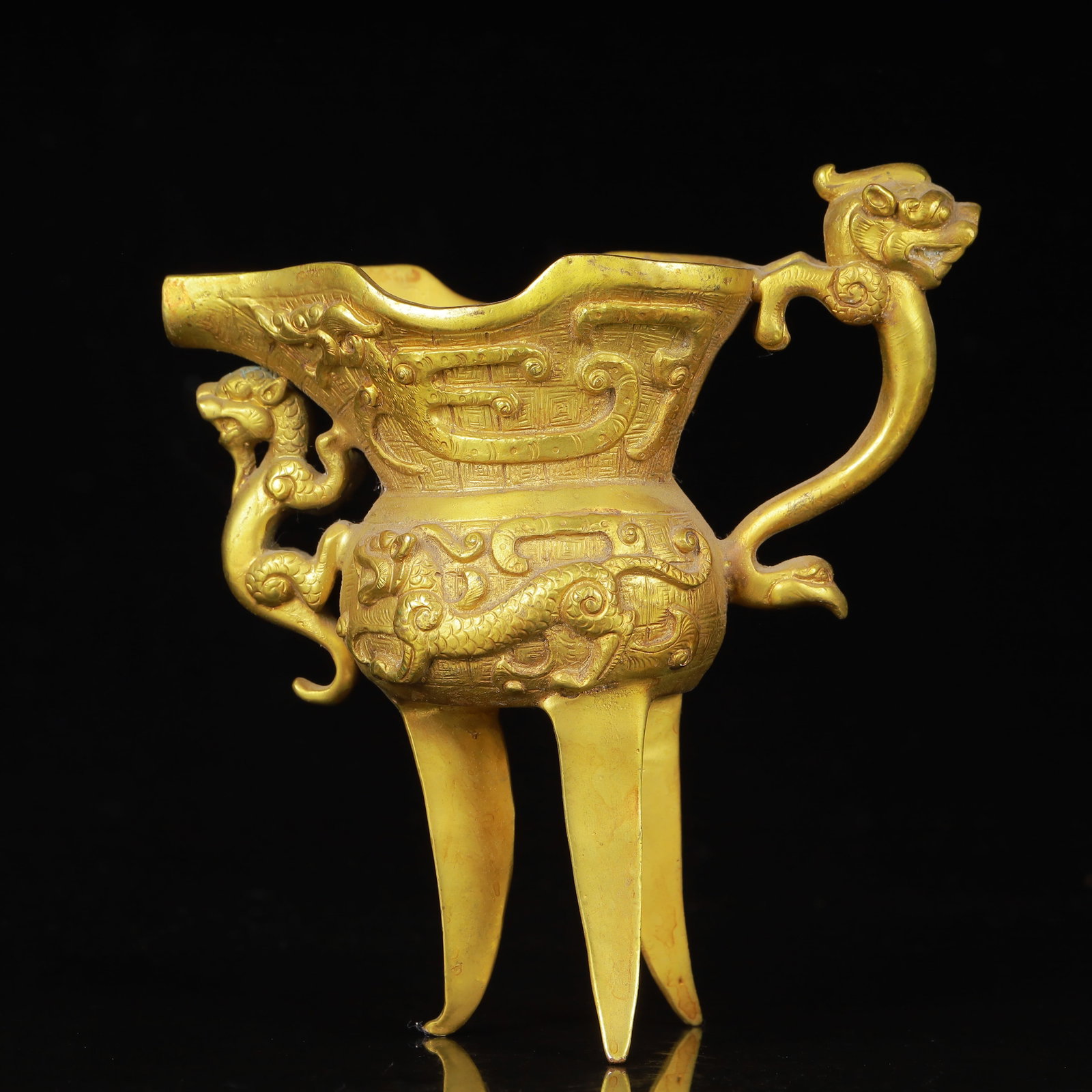 An Exquisite Gilt Bronze Dragon Pattern Beast-Ears Tripod Cup (1 of 11)