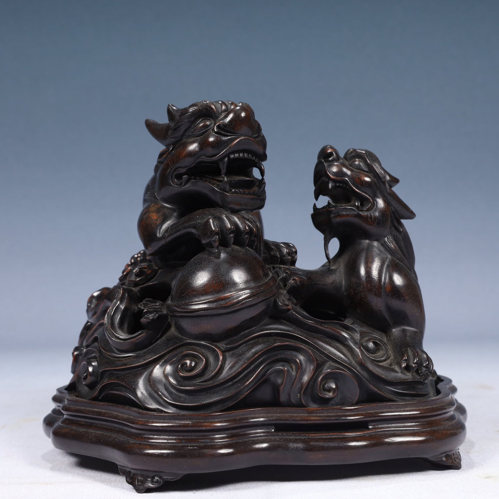 An Exquisite Zitanwood Lion Ornament,With Base: An Exquisite Zitanwood Lion Ornament,With Base,Qing Dynasty, China,Size:7.1inx5.9inx6.3in,Weight:1150g