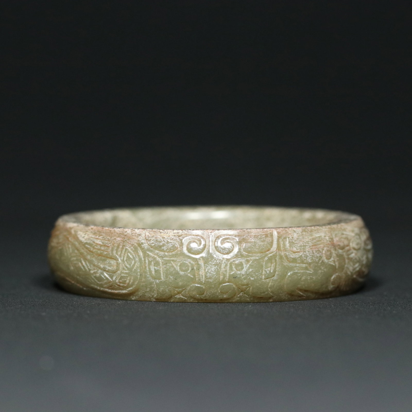 An Exquisite Archaic Jade Beast-Face Pattern Bracelet: An Exquisite Archaic Jade Beast-Face Pattern Bracelet,Western Zhou Dynasty,China,Size:3.1inx0.7inx2.4in,Weight:84.9g 高古玉兽面纹手镯,中国&#
