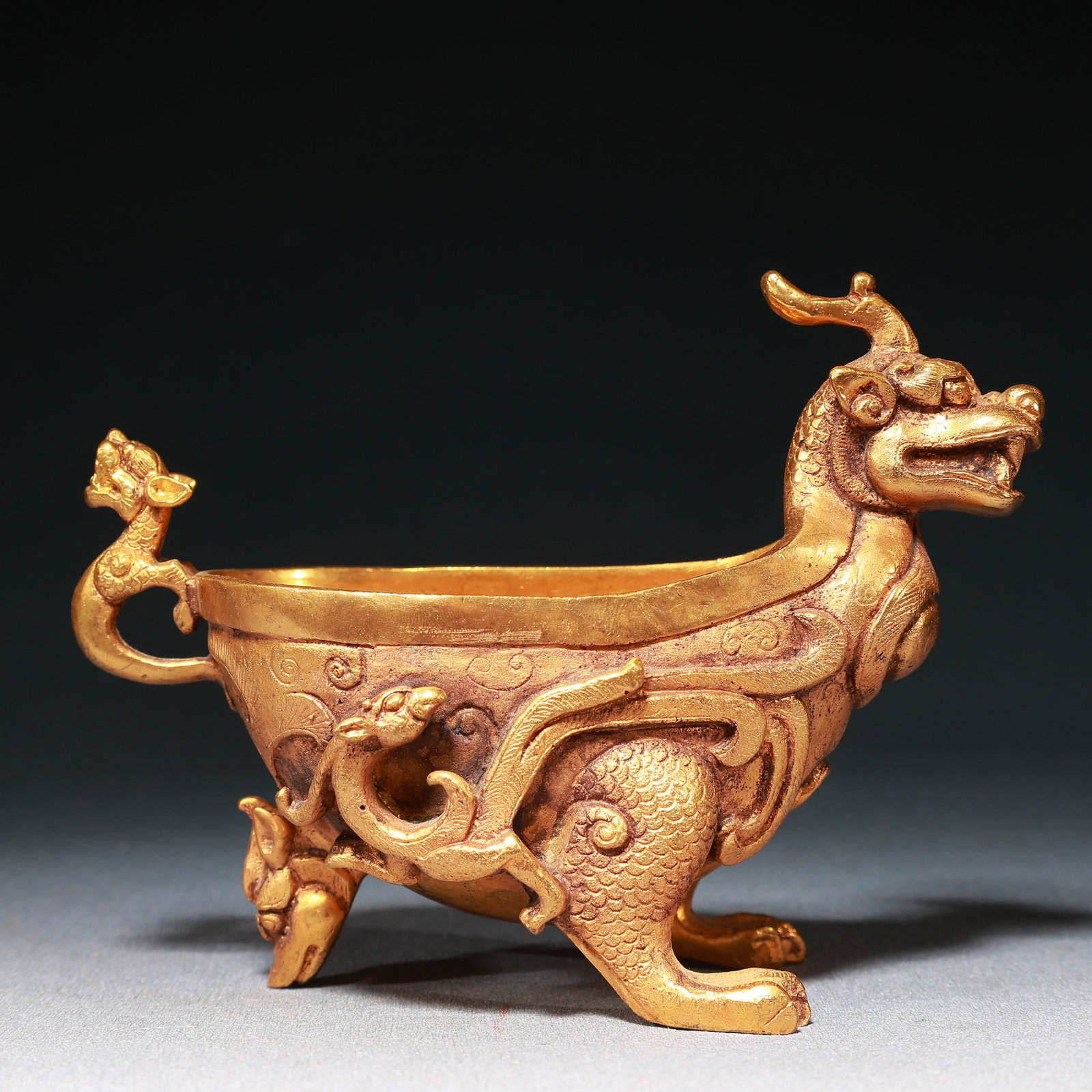 An Exquisite Gilt Bronze Phoenix Pattern Dragon-head Beast-Shaped Cup: An Exquisite Gilt Bronze Phoenix Pattern Dragon-head Beast-Shaped Cup,Qing Dynasty,China,Size:5.9inx2.6inx4.3in,Weight:800g