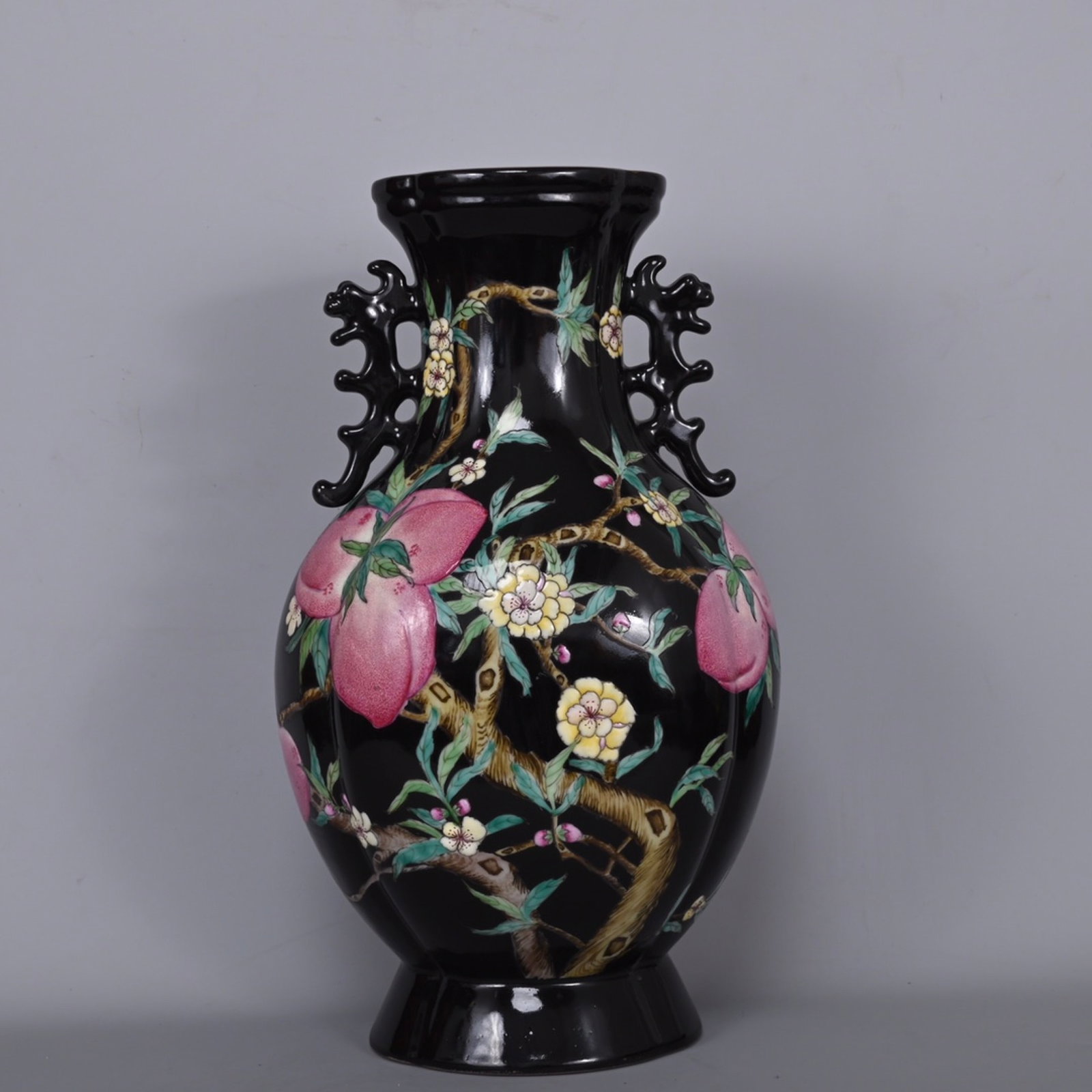 A Rare Black Glazed Famille-Rose Bats and Peach Pattern Double-Ears Vase: A Rare Black Glazed Famille-Rose Bats and Peach Pattern Double-Ears Vase,Qing Dynasty,China,Qianlong Four-character Mark,Size:13.6inx7.9in 黑釉粉彩福寿纹Ö