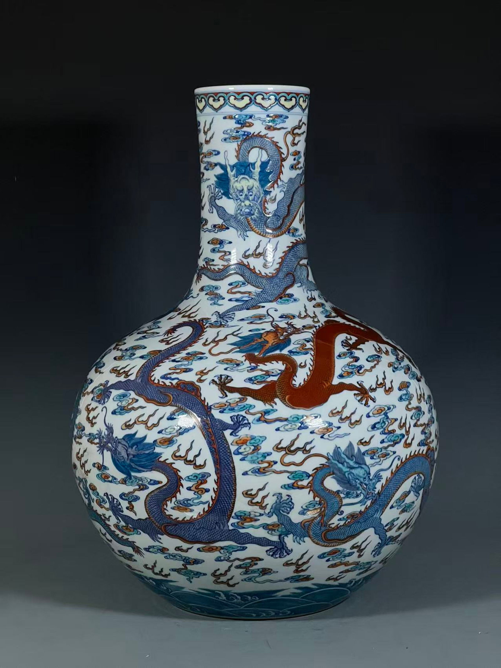 A Huge Doucai Auspicious Cloud and Dragon Pattern Vase: A Huge Doucai Auspicious Cloud and Dragon Pattern Vase,Qing Dynasty,China,Qianlong Six-character Mark,Size:21.9inx7.5in 斗彩祥云龙纹瓶,中国清
