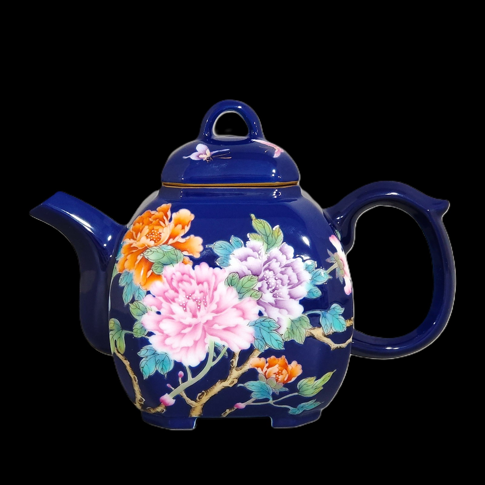 An Exquisite Sapphire Blue Glazed Flower and Butterfly Pattern Teapot: An Exquisite Sapphire Blue Glazed Flower and Butterfly Pattern Teapot,Qing Dynasty,China,Qianlong Four-character Mark,Size:4.7inx5.9in