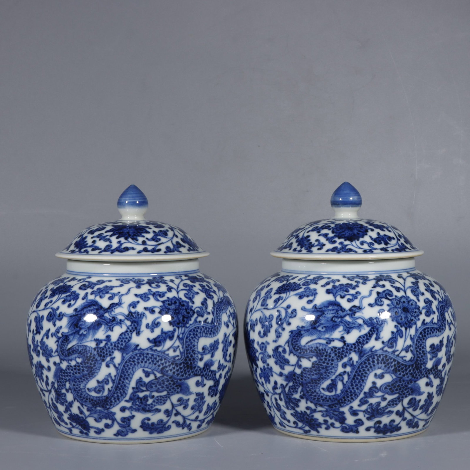 A Pair of Exquisite Blue and White Lotus and Dragon Pattern Jars with Cover: A Pair of Exquisite Blue and White Lotus and Dragon Pattern Jars with Cover,Qing Dynasty,China,Qianlong Six-character Mark,Size:6.7inx5.9in
