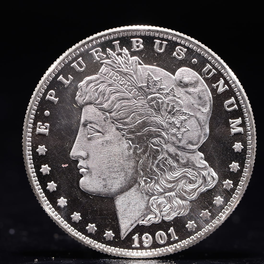 USA Morgan Dollar 1901 Coin: Obv: profile bust with date below and E PLURIBUS UNUM legend and stars around. Rev: eagle with In God we trust above within wreath with UNITED STATES OF AMERICA ONE DOLLAR legend. IN GOD WE TRUST /