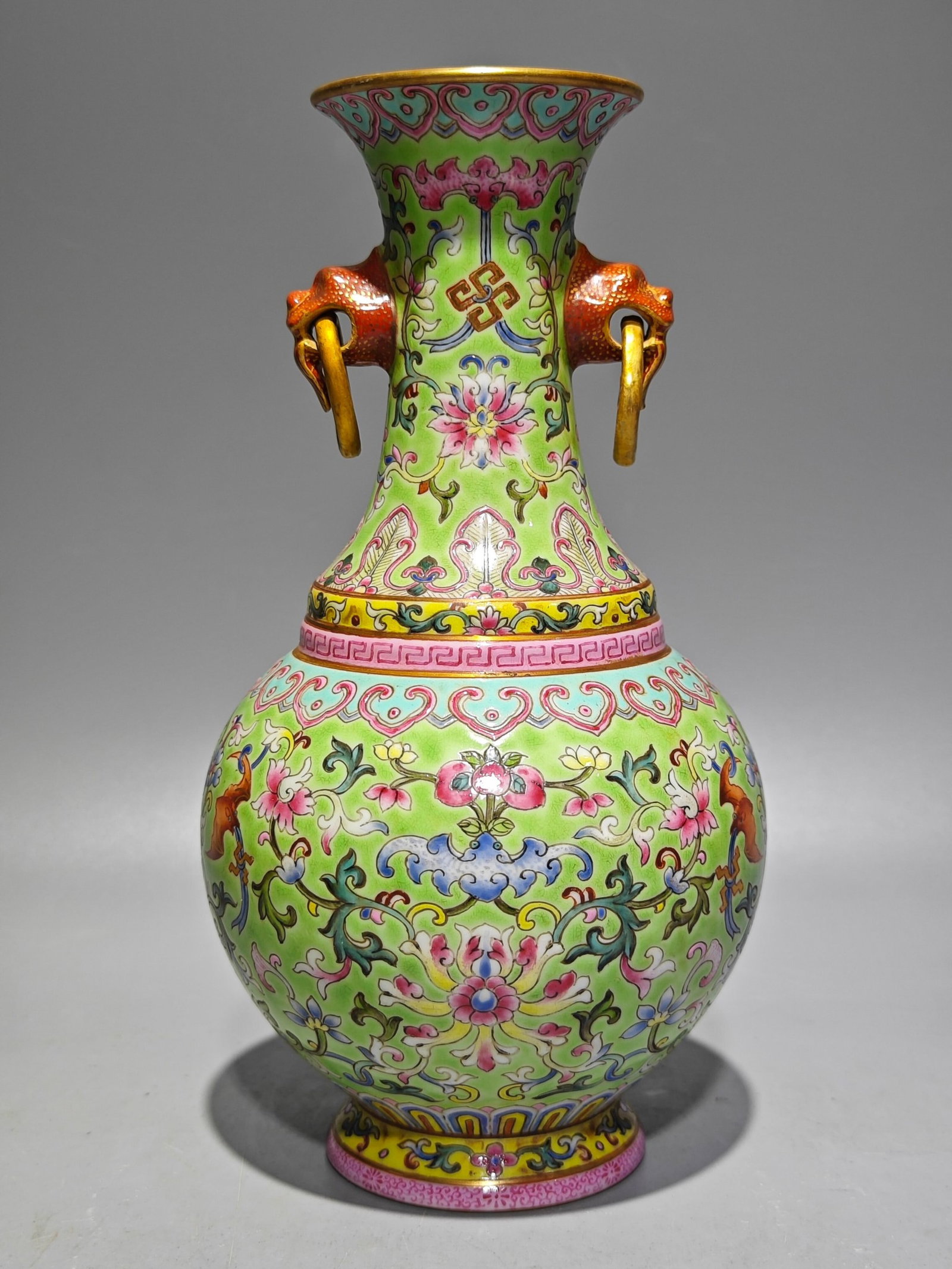 An Exquisite Green Ground Famille-Rose Lotus Pattern Double-Ears Vase: An Exquisite Green Ground Famille-Rose Lotus Pattern Double-Ears Vase,Qing Dynasty,China,Qianlong Six-character Mark,Size:8.1inx4.3in