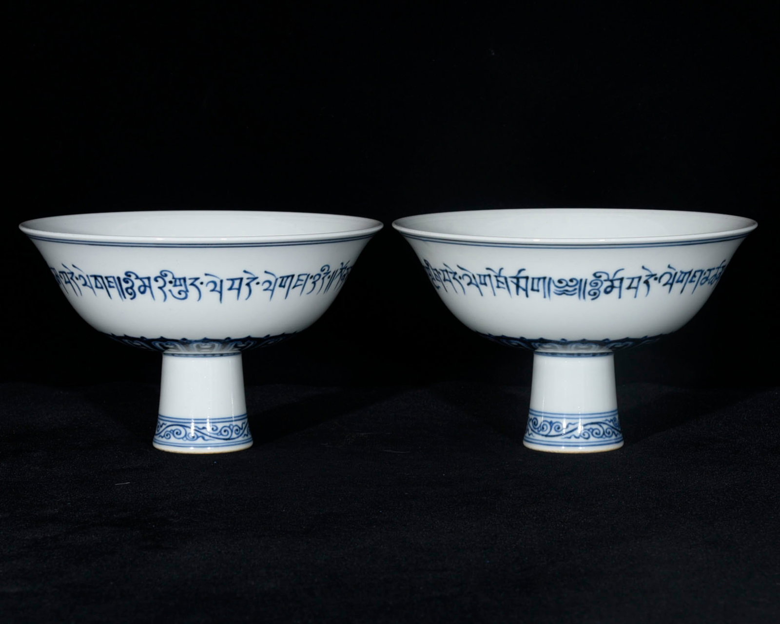 A Pair of Exquisite Blue and White Stem Bowls,With Sanskrit: A Pair of Exquisite Blue and White Stem Bowl,With Sanskrit,Ming Dynasty,China,Xuande Four-character Mark,Size:4.1inx6.9ins 一对青花高足碗,带梵