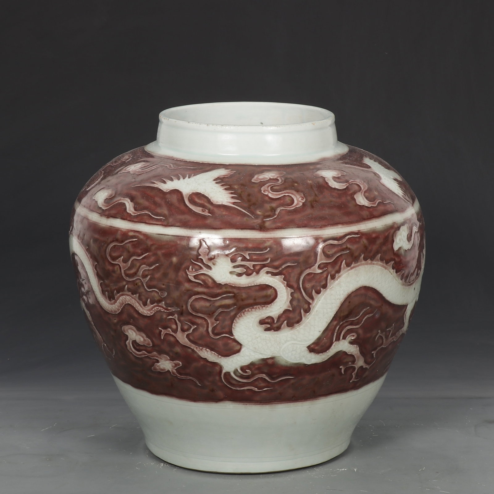 A Rare Underglaze-Red Auspicious Cloud and Dragon Pattern Jar: A Rare Underglaze-Red Auspicious Cloud and Dragon Pattern Jar,Yuan Dynasty,China,Size:13.4inx13in 釉里红祥云龙纹罐,中国元代