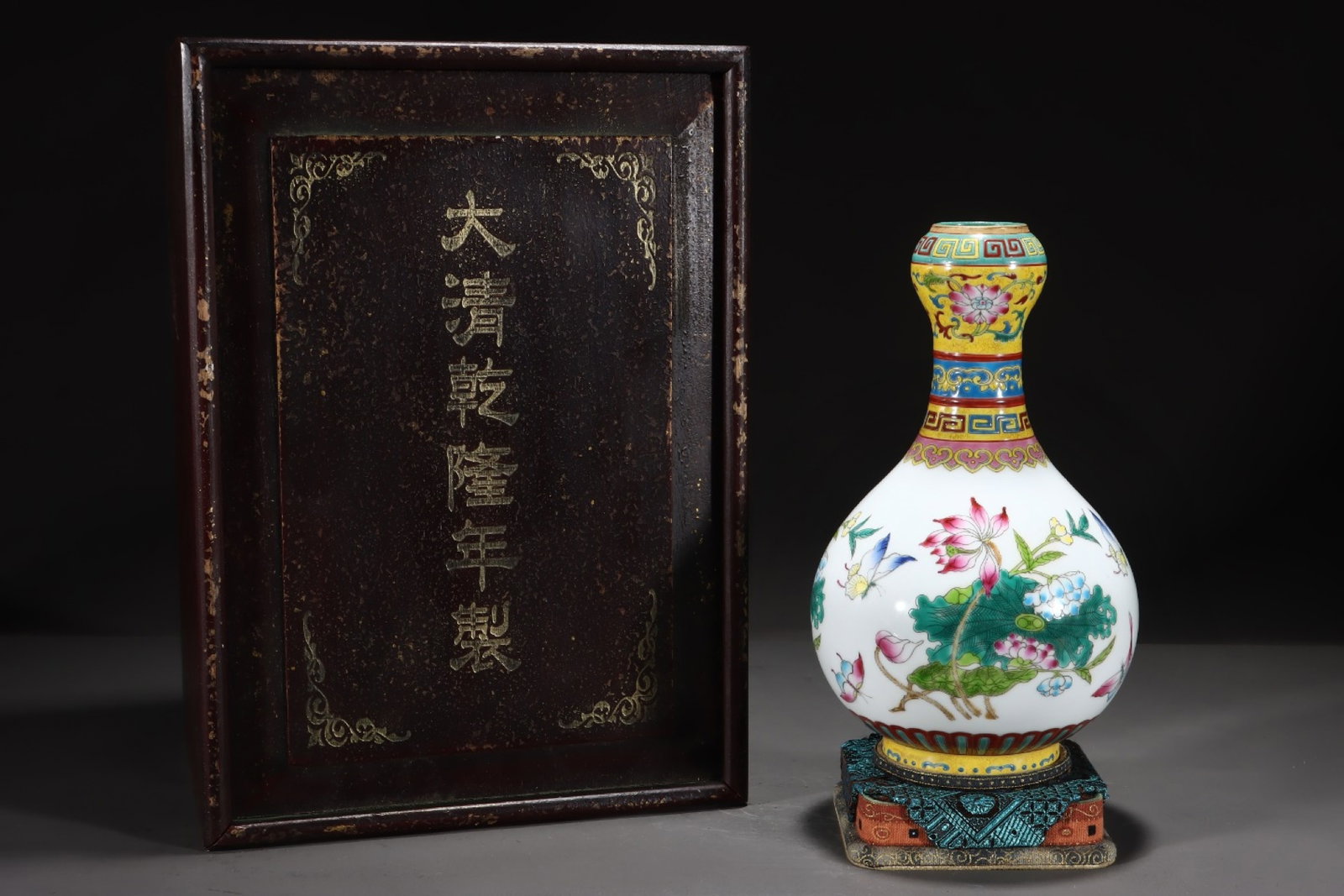 An Exquisite Yellow Ground Famille-Rose Flower Painted Gold Vase: An Exquisite Yellow Ground Famille-Rose Flower Pattern Painted Gold Vase,Qing Dynasty, China,Qianlong Six-character Mark,Size:9.4inx5.6in