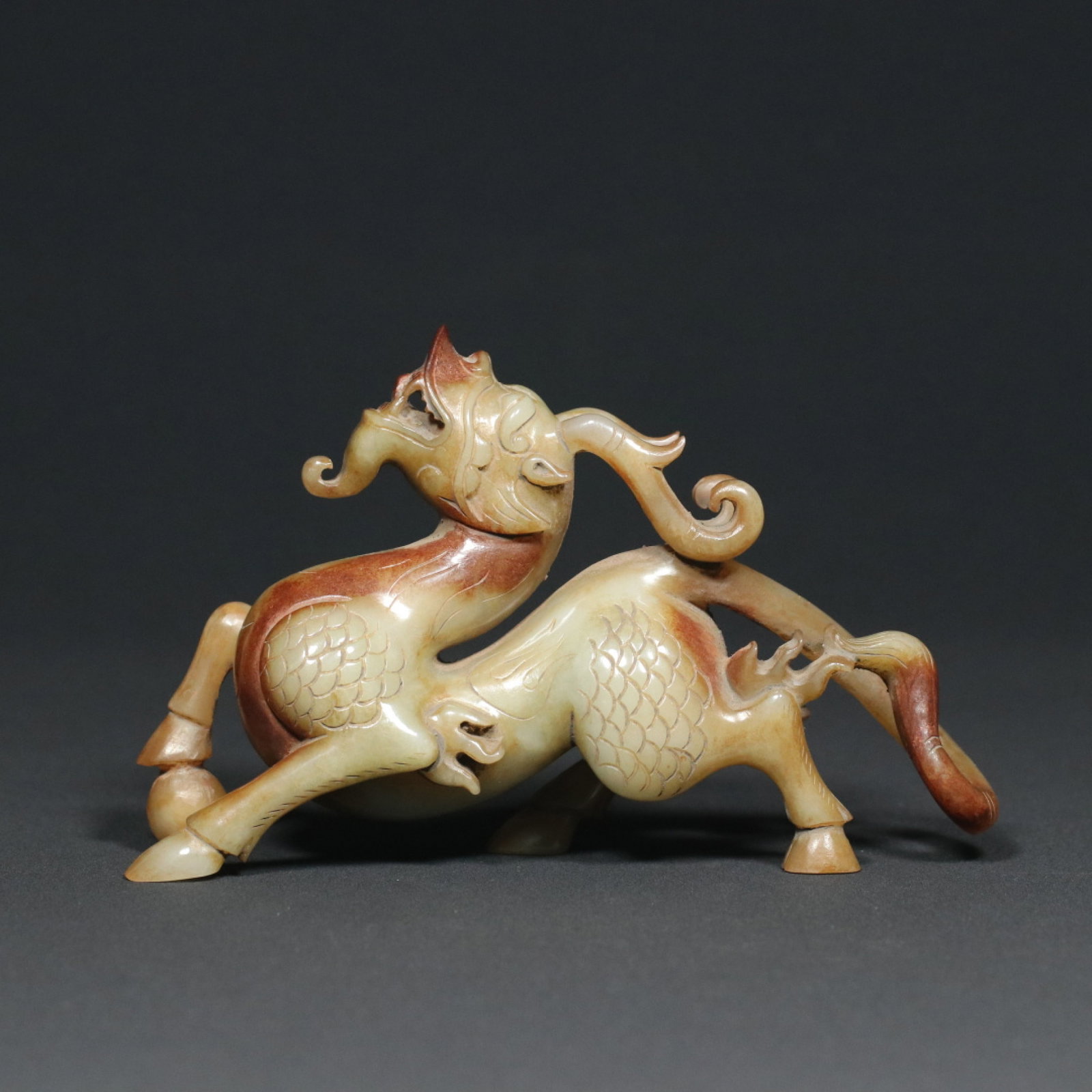 An Exquisite White Jade Auspicious Beast Ornament: An Exquisite White Jade Auspicious Beast Ornament,Han Dynasty,China,Size:5.9inx1.6inx3.5in,Weight:323.6g 白玉瑞兽摆件,中国汉代