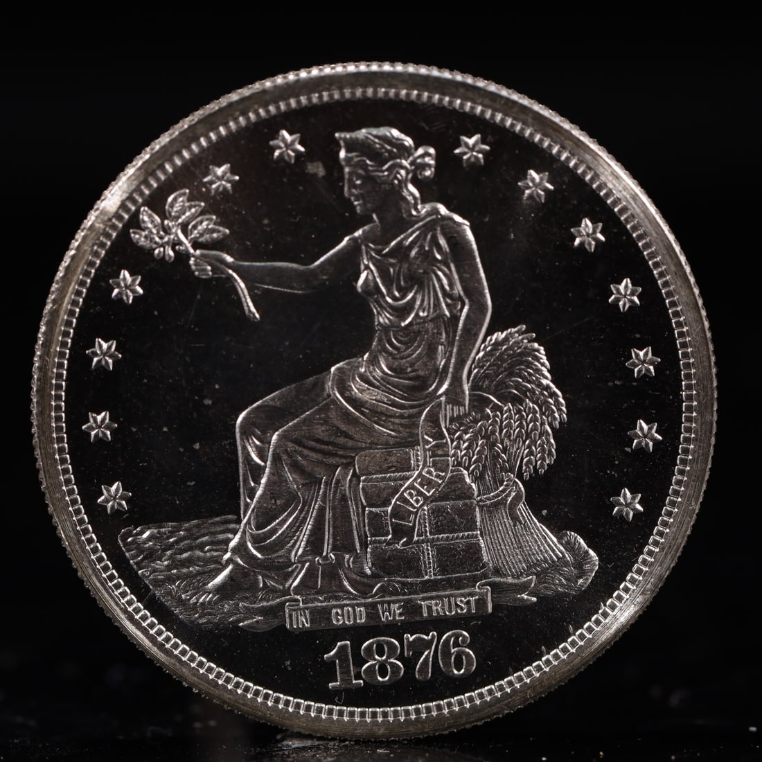 USA Trade Dollar 1876 Coin: American coin. Obverse: Liberty seated on a pedestal facing the sea to the left holding olive branches surrounded by 13 stars. IN GOD WE TRUST / LIBERTY / 1876. Reverse: An eagle holding branches with