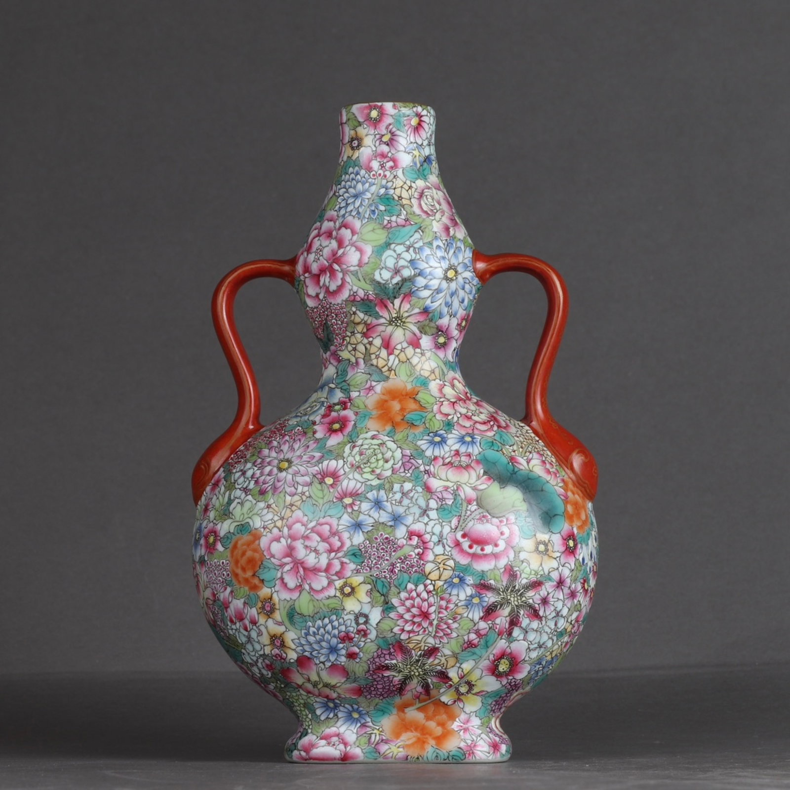 An Exquisite Enamel Flower Pattern Double-Ears Vase: An Exquisite Enamel Flower Pattern Double-Ears Vase,Qing Dynasty,China,Qianlong Six-character Mark,Size:7.8inx4.9in 珐琅彩花卉纹双耳瓶,中