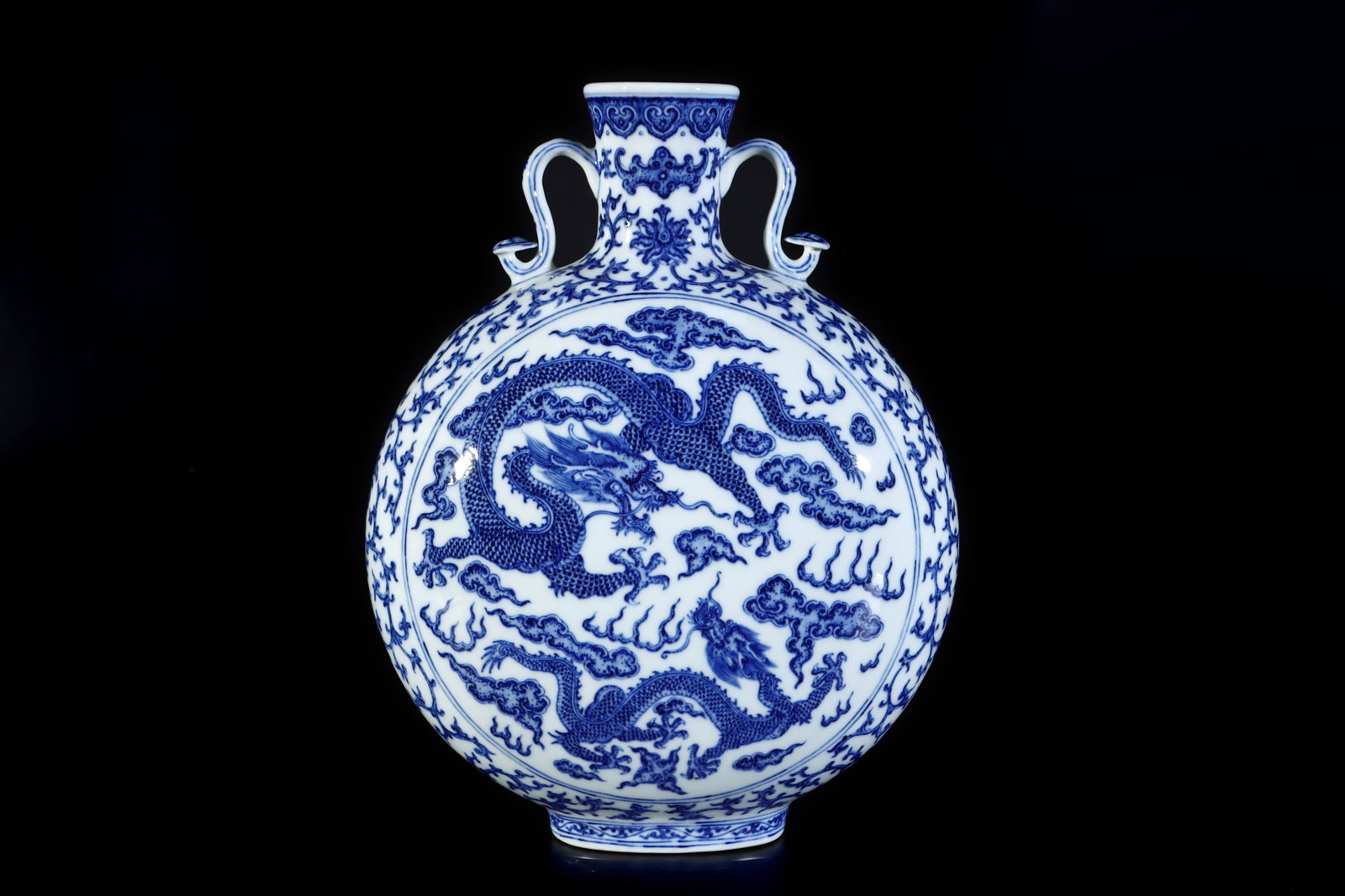 A Rare Blue and White Auspicious Cloud and Dragon Pattern Double-Ears Vase: A Rare Blue and White Auspicious Cloud and Dragon Pattern Double-Ears Vase,Qing Dynasty,China,Qianlong Six-character Mark,Size:13.2inx10.6in