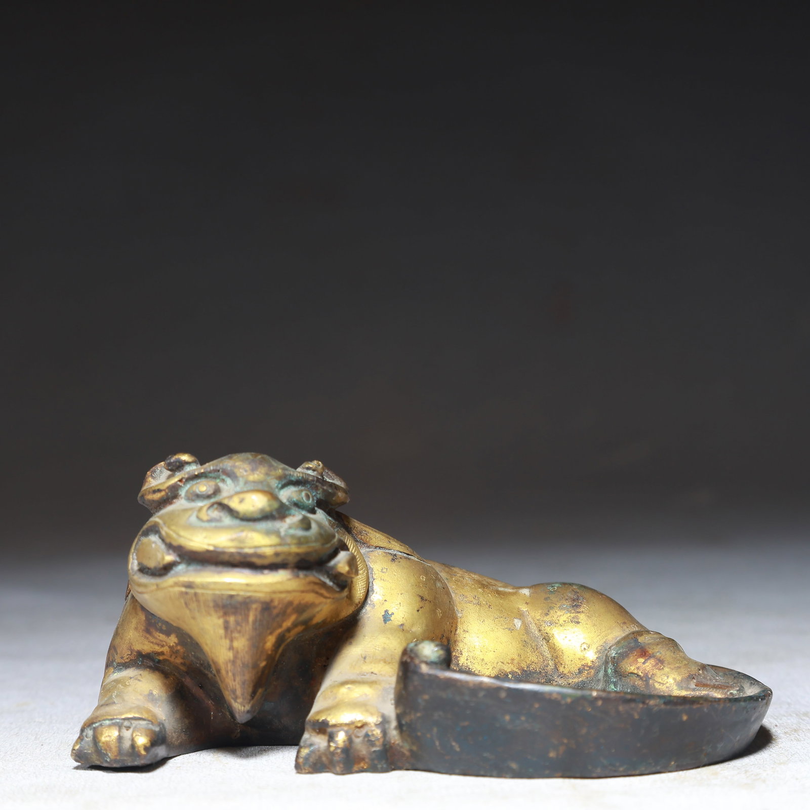 An Exquisite Gilt Bronze Beast-Shaped Inkstone: An Exquisite Gilt Bronze Beast-Shaped Inkstone,Qing Dynasty,China,Size:4.5inx2.8inx2in,Weight:350g 铜鎏金兽形砚台,中国清代