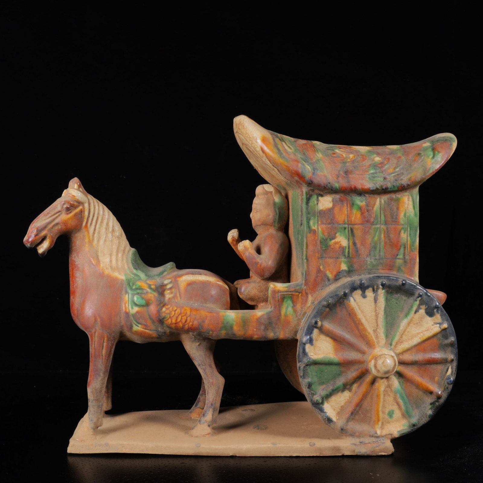 An Exquisite Tang Tri-Color Glazed Pottery Carriage Ornament: An Exquisite Tang Tri-Color Glazed Pottery Carriage Ornament,Tang Dynasty,China,Size:11.4inx14.2inx5.5in,Weight:3040g 唐三彩马车摆件,中国唐&