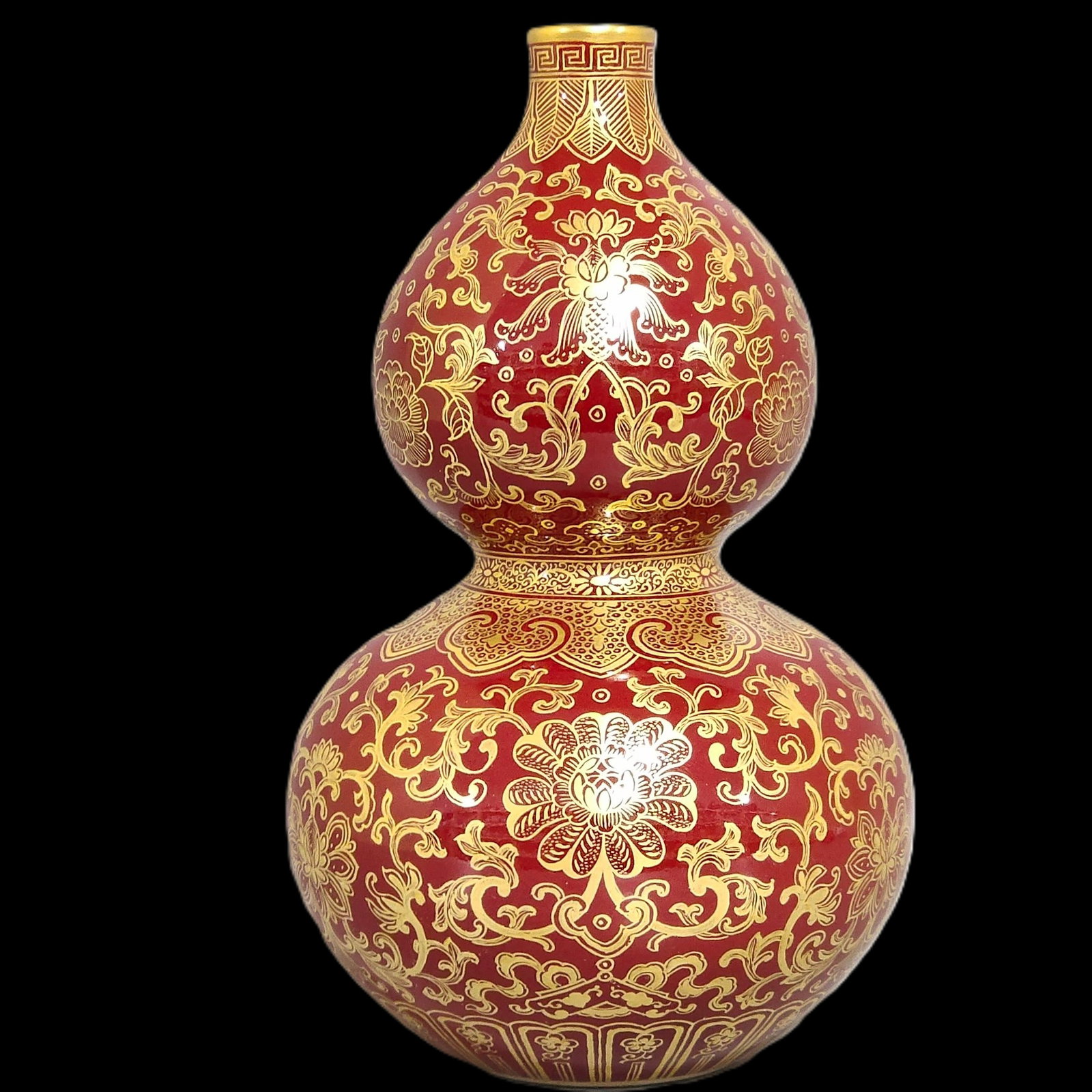 An Exquisite Red Ground Painted Gold Lotus Pattern Gourd-Shaped Vase: An Exquisite Red Ground Painted Gold Lotus Pattern Gourd-Shaped Vase,Qing Dynasty,China,Qianlong Six-character Mark,Size:7.5inx4.7in 红地描金缠枝莲纹