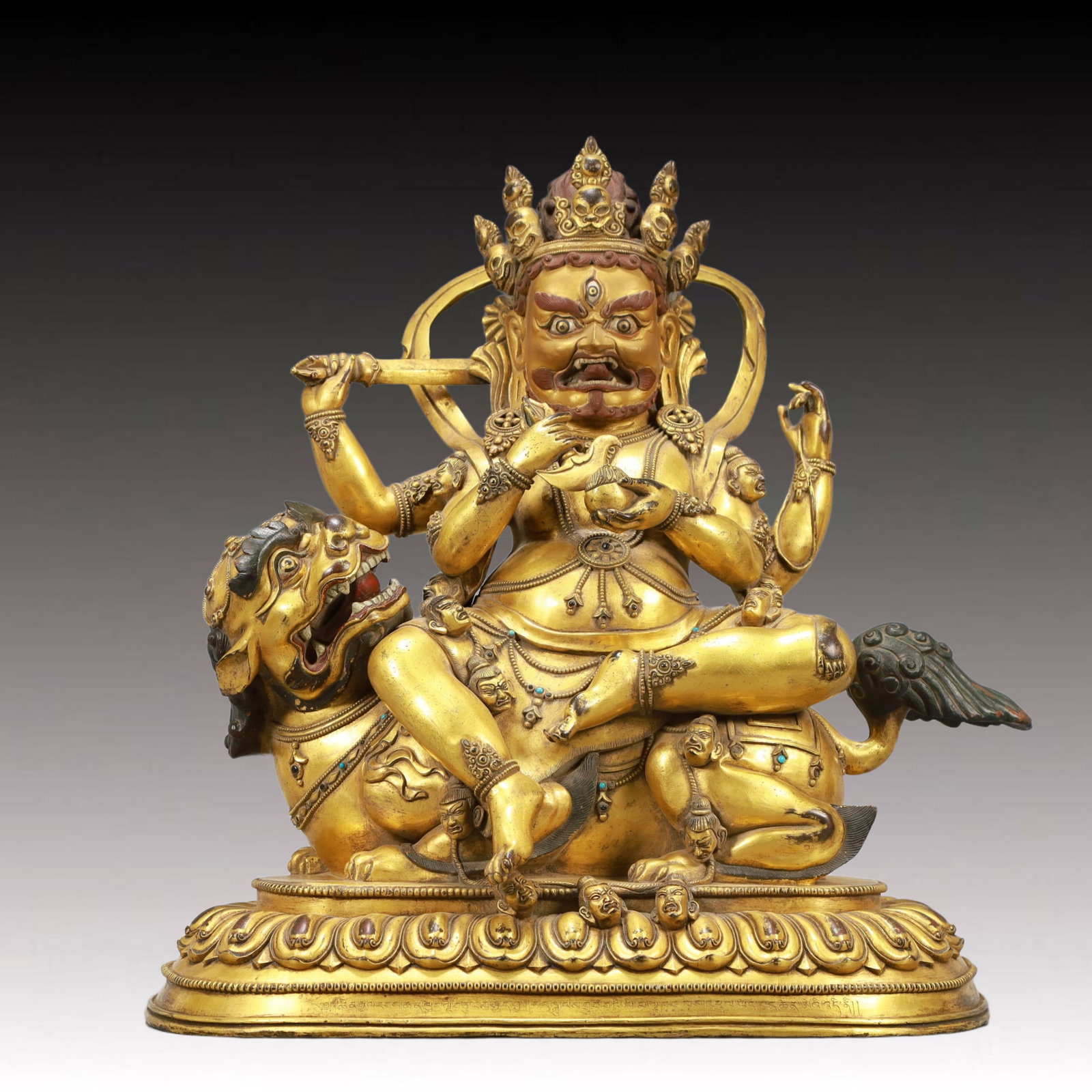 A Solemn Gilt Bronze Statue of Mammon Rides the Lion,Inlaid Turquoise,With Inscription: A Solemn Gilt Bronze Statue of Mammon Rides the Lion,Inlaid Turquoise,With Inscription,Qing Dynasty, China,Qianlong Mark,Size:13.8inx7.9inx15in,Weight:12800g