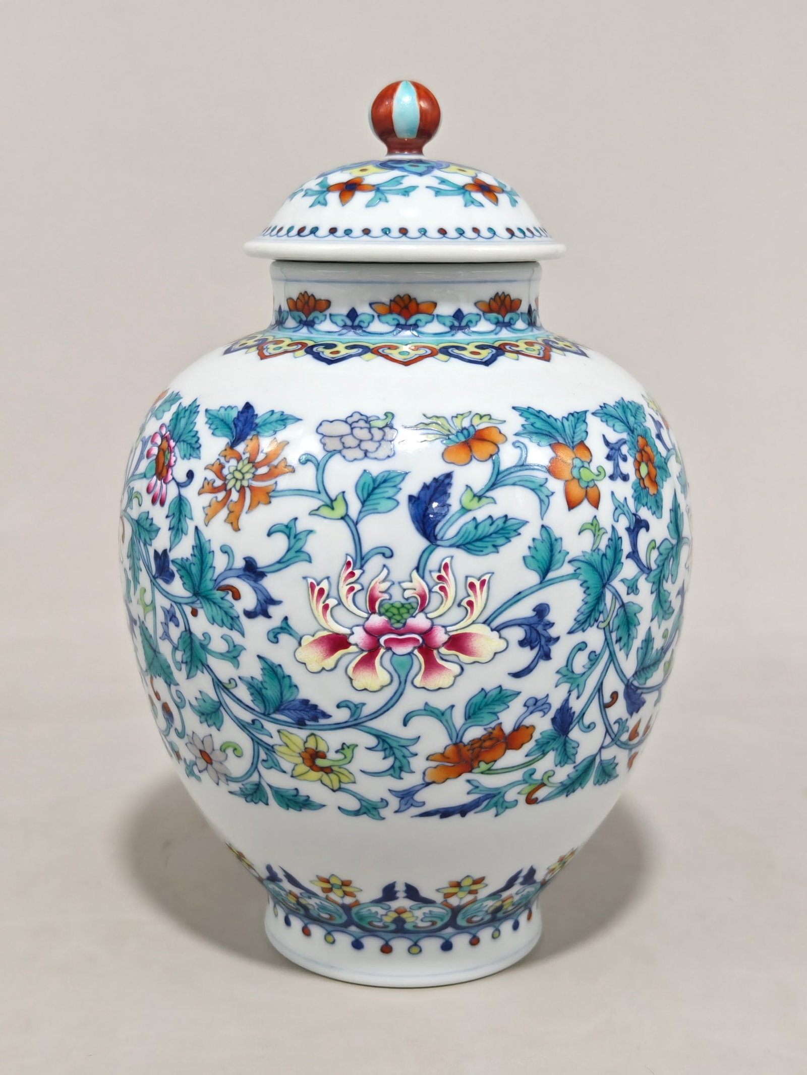 An Exquisite Doucai Lotus Pattern Jar with Cover: An Exquisite Doucai Lotus Pattern Jar with Cover,Qing Dynasty,China,Qianlong Six-character Mark,Size:9.8inx6.3in 斗彩缠枝莲纹盖罐中国清