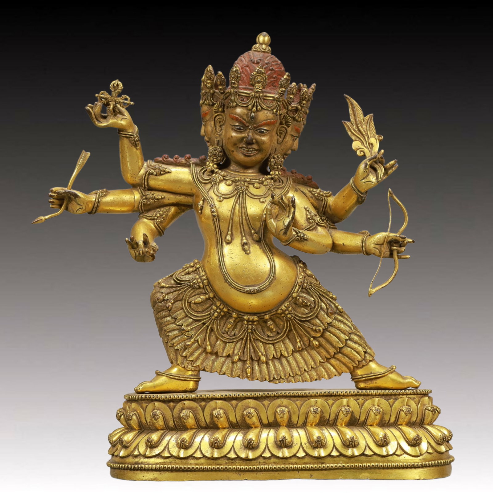 A Solemn Gilt Bronze Statue of Three-Headed and Six-Armed Vajra: A Solemn Gilt Bronze Statue of Three-Headed and Six-Armed Vajra,Ming Dynasty, China,Size:9.4inx4.1inx12.8in,Weight:6900g 铜鎏金三头六臂金刚像