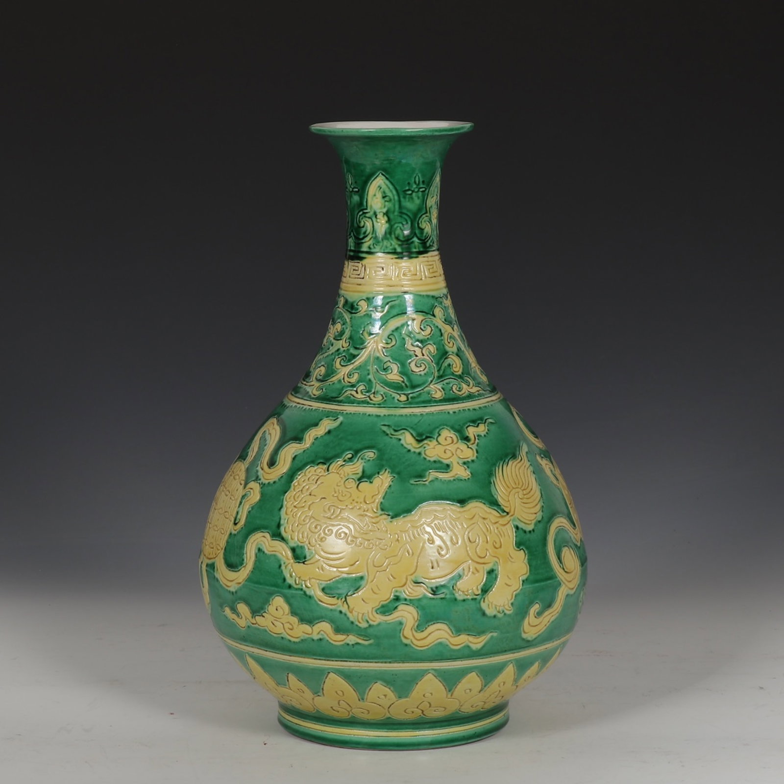 A Rare Green Ground Yellow Glazed Lion Pattern Vase: A Rare Green Ground Yellow Glazed Lion Pattern Vase,Ming Dynasty,China,Xuande Six-character Mark,Size:12.6inx8.3in 绿地黄釉狮子纹瓶,中国