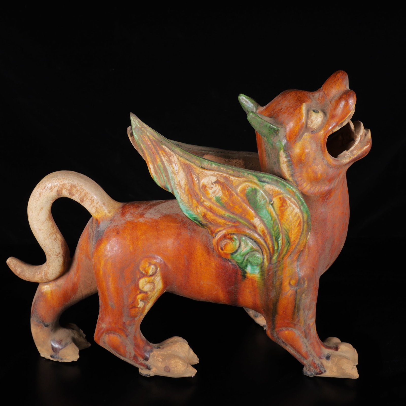 An Exquisite Tang Tri-Color Glazed Pottery Auspicious Beast Ornament: An Exquisite Tang Tri-Color Glazed Pottery Auspicious Beast Ornament,Tang Dynasty,China,Size:8.7inx9.8inx10.2in,Weight:2620g