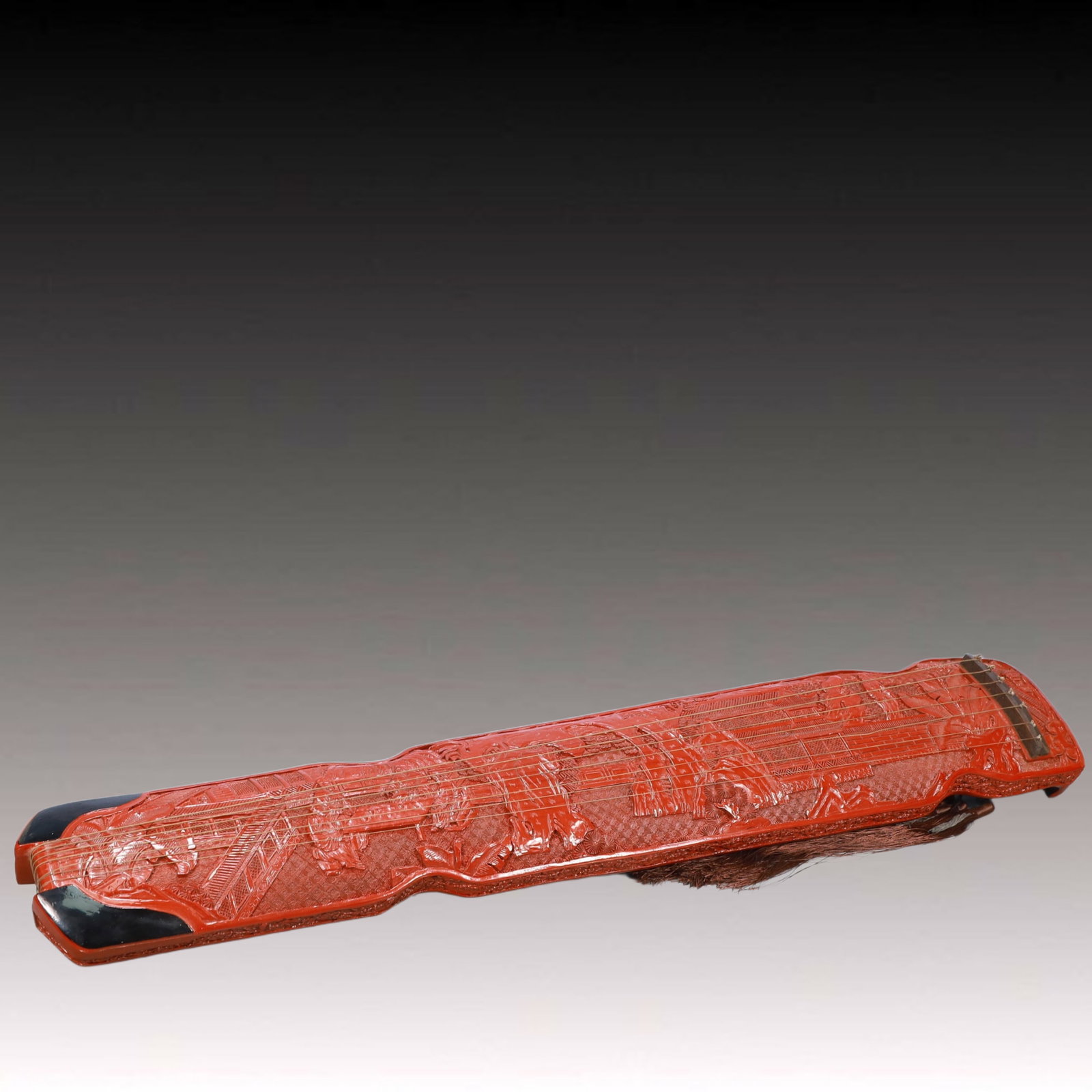An Exquisite Carved Red Lacquer Figure Pattern 'qin' Ornament: An Exquisite Carved Red Lacquer Figure Pattern 'qin' Ornament,Qing Dynasty, China,Size:49.2inx7.9inx4.3in,Weight:4300g 剔红漆器人物纹琴摆件,