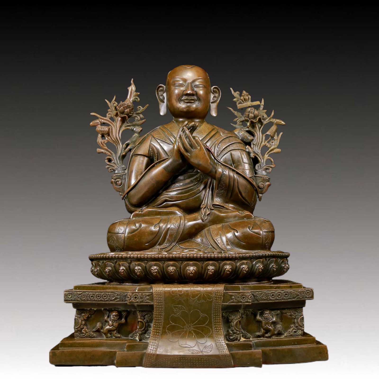 A Brilliant Alloy Copper Figure Of Brog.Mi With marks: Brilliant Alloy Copper Figure Of Brog.Mi With marks. Seated, body rendered clad in long, flowing robes, the voluminous drapery elegantly cascading in folds, and leafy plants flanking the broad shoulde