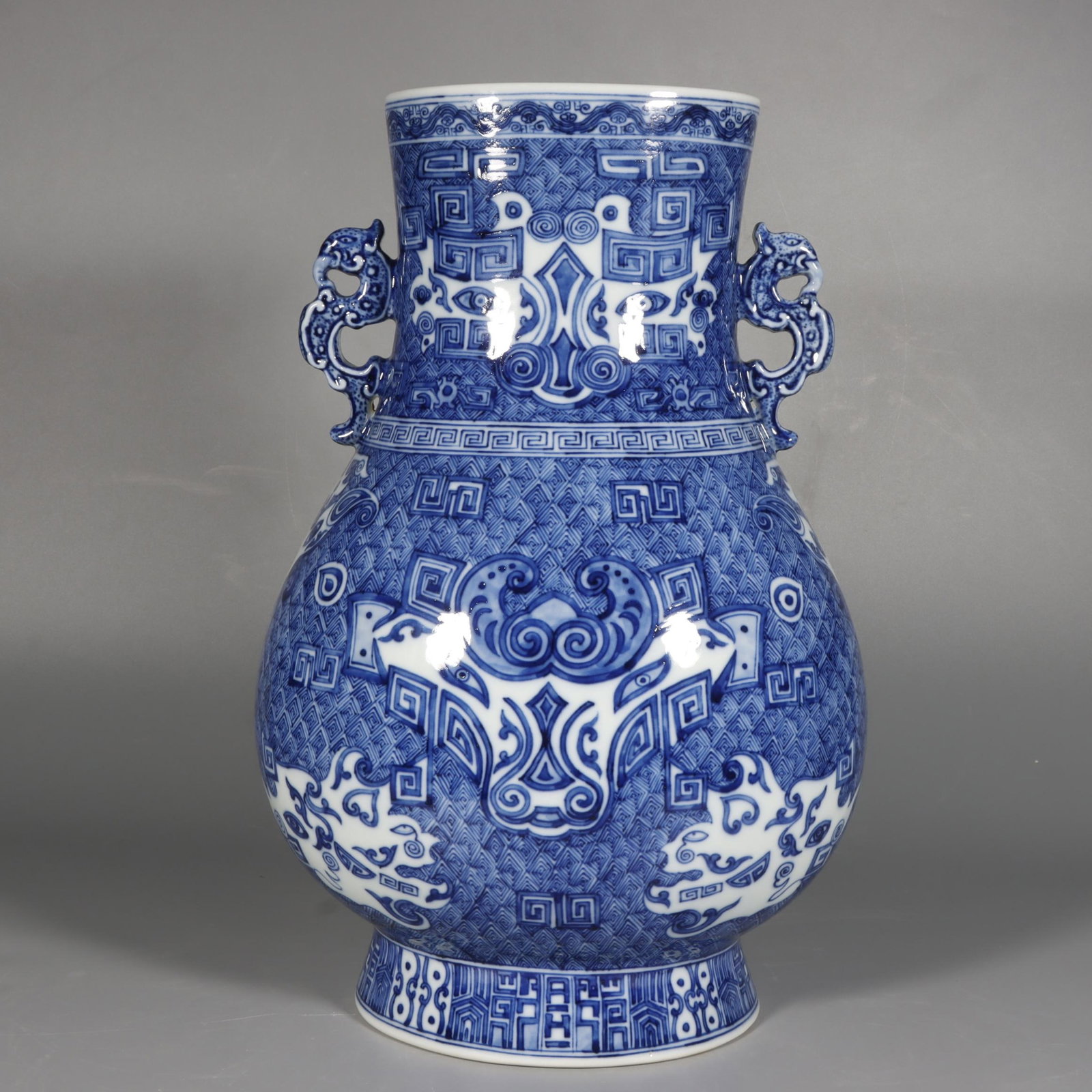A Rare Blue and White Beast-Face Pattern Double-Ears Vase: A Rare Blue and White Beast-Face Pattern Double-Ears Vase,Qing Dynasty,China,Qianlong Six-character Mark,Size 15inx9.6in 青花兽面纹双耳瓶中国