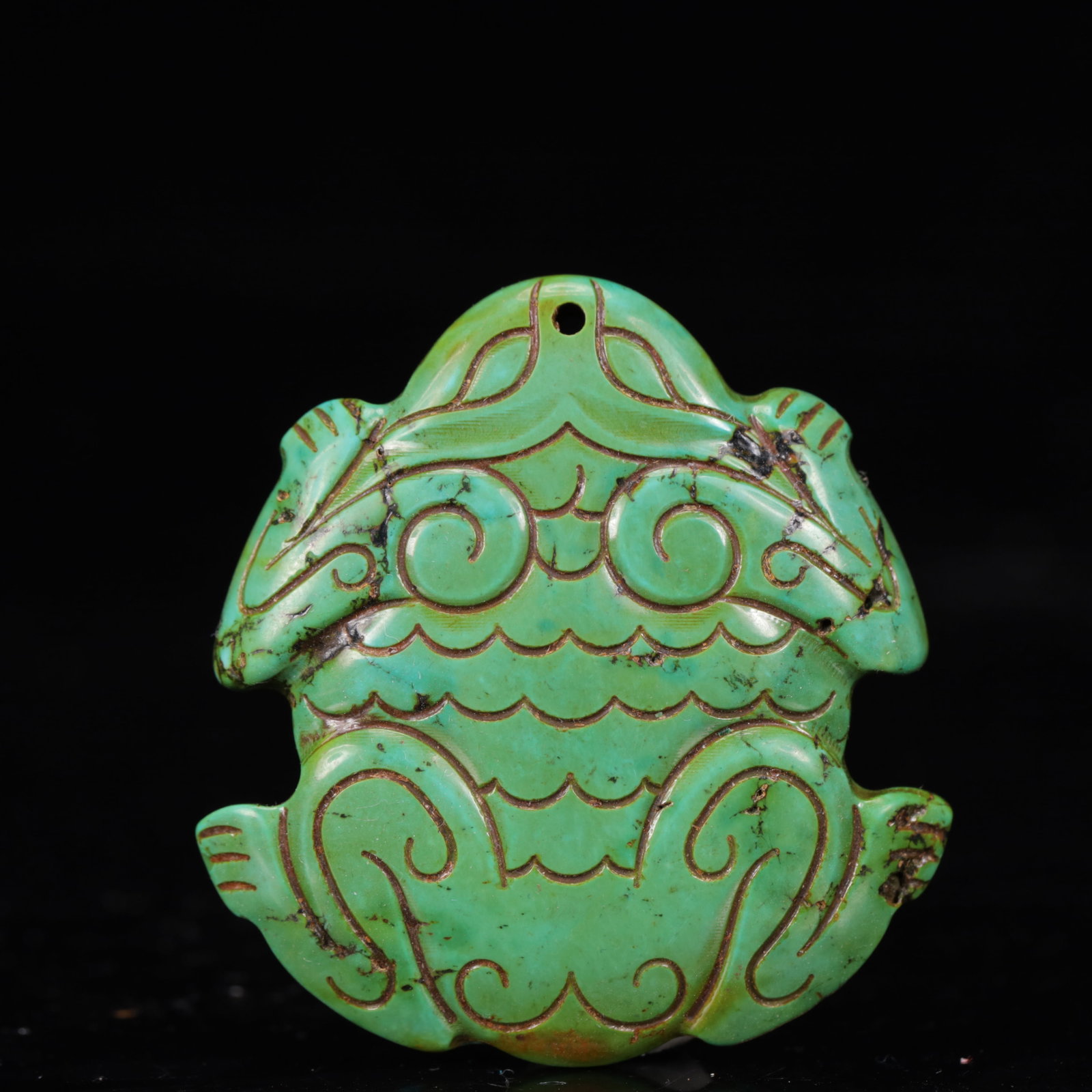 An Exquisite Turquoise Animal Pattern Pendant: An Exquisite Turquoise Animal Pattern Pendant,The Warring States period in China,Size:1.8inx1.9inx0.3in,Weight:27g 绿松石动物纹挂件,中国