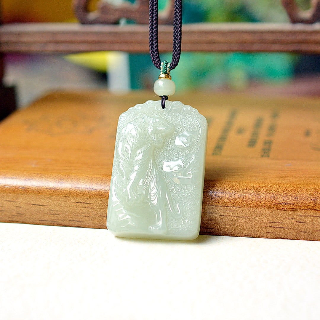 An Exquisite White Jade Tiger Pendant: An Exquisite White Jade Tiger Pendant,Size:1.3inx2in 白玉老虎挂件