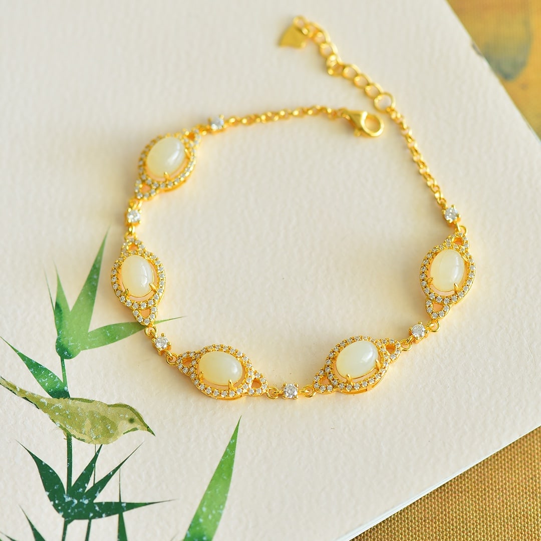 An Exquisite Sterling Silver-Gold Plated Inlaid White Jade Bracelet: An Exquisite Sterling Silver-Gold Plated Inlaid White Jade Bracelet, 纯银镀金镶白玉手链