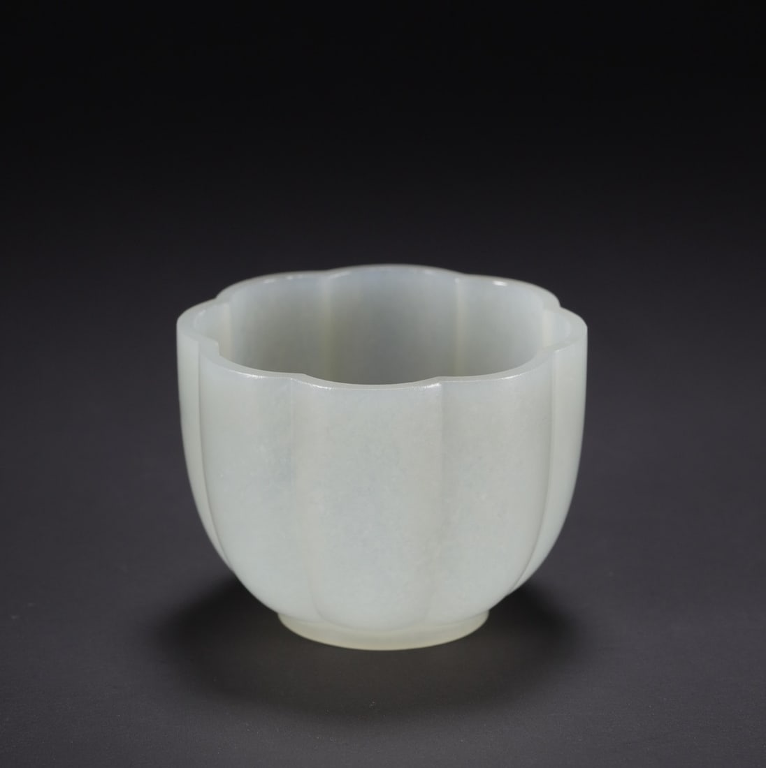 An Exquisite White Jade Cup: An Exquisite White Jade Cup Qing Dynasty, China Diameter Size:2.1in Size:1.6in Weight:39.3g白玉花口杯 中国清代 Diameter Size:5.3cm Size:4.0cm