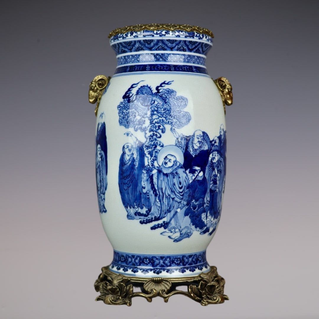 An Exquisite Blue and White Inlaid Bronze Character and Story Pattern Double-Ears Vase: An Exquisite Blue and White Inlaid Bronze Character and Story Pattern Double-Ears Vase Qing Dynasty, China Size:18.1inx9.4in青花十八罗汉镶铜羊