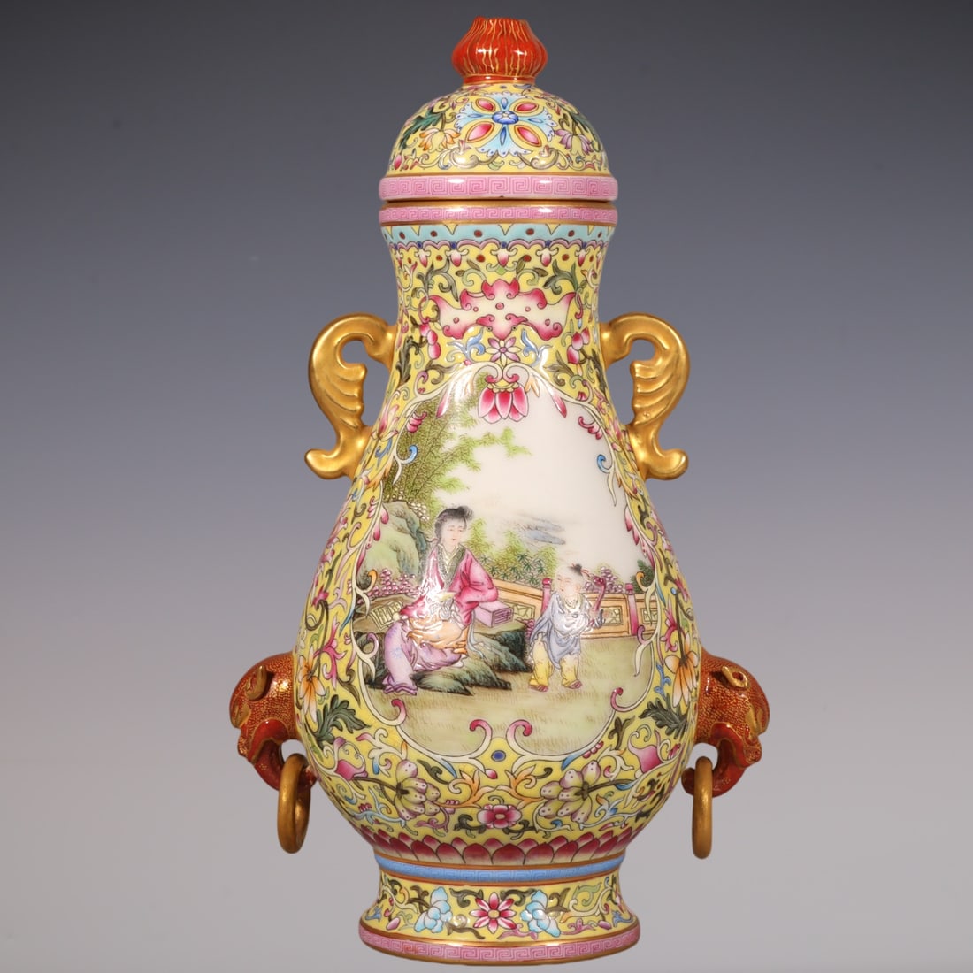An Exquisite Enamel Lotus Pattern Character and Story Pattern Double-Ears Jar: An Exquisite Enamel Lotus Pattern Character and Story Pattern Double-Ears Jar Qing Dynasty, China Qianlong Four-character Mark Size:9.4inx5.5in珐琅彩黄地缠枝&