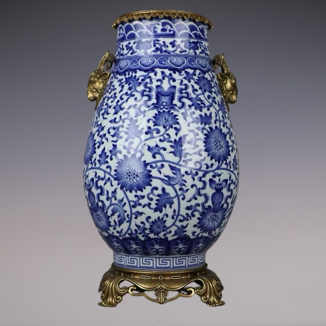 An Exquisite Blue and White Inlaid Bronze Lotus Pattern Seawater Pattern Double-Ears Vase: An Exquisite Blue and White Inlaid Bronze Lotus Pattern Seawater Pattern Double-Ears Vase Qing Dynasty, China Qianlong Six-character Mark Size:17.9inx9.4in青花图案镶Ž