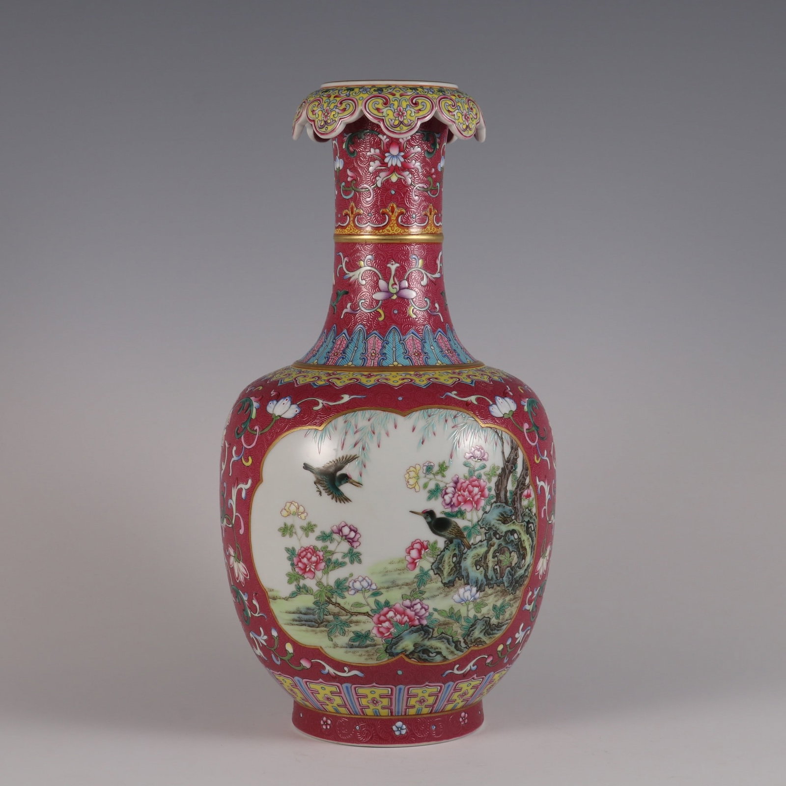 An Exquisite Famille-Rose Ruby Red-Glazed Flower and Bird Pattern Lotus Pattern Vase: An Exquisite Famille-Rose Ruby Red-Glazed Flower and Bird Pattern Lotus Pattern Vase Qing Dynasty, China Qianlong Six-character Mark Size:13.2inx6.7in胭脂红地扒花&#
