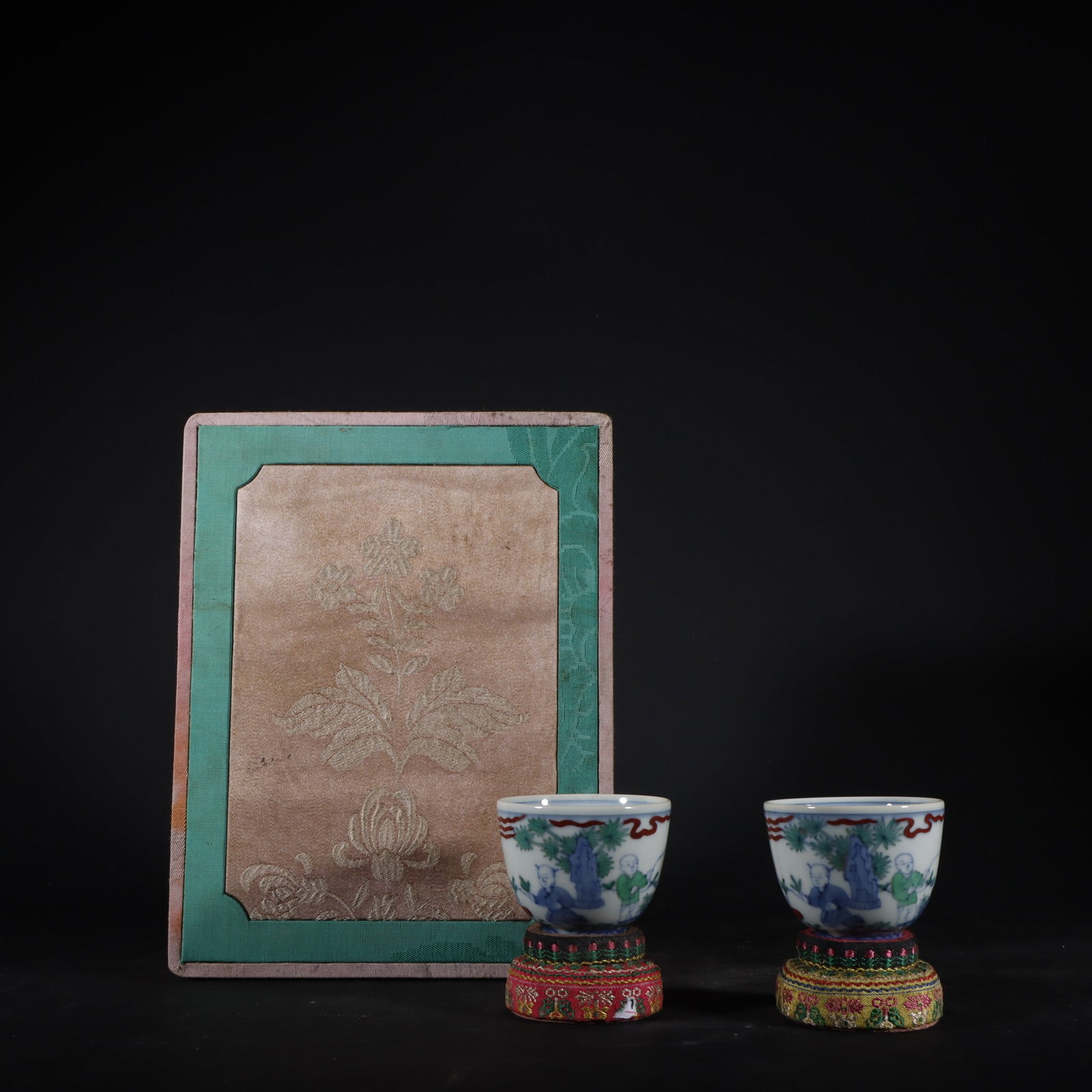 A Pair of Exquisite Doucai Character and Story Pattern Cup: A Pair of Exquisite Doucai Character and Story Pattern Cup Ming Dynasty, China Chenghua Six-character Mark Size:1.8inx2.4in斗彩婴戏图杯一对 中