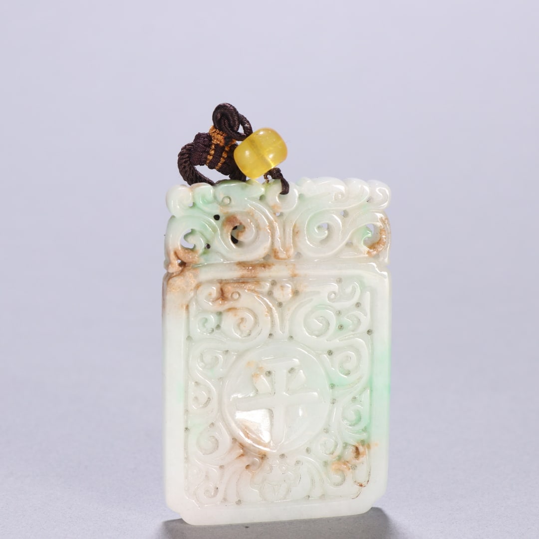 An Exquisite Jadeite Brand: An Exquisite Jadeite Brand Qing Dynasty, China Size:2.6inx1.7in Weight:54.6g翡翠平安挂牌 中国清代 Size:6.5cmx4.3cm Weight:54.6g