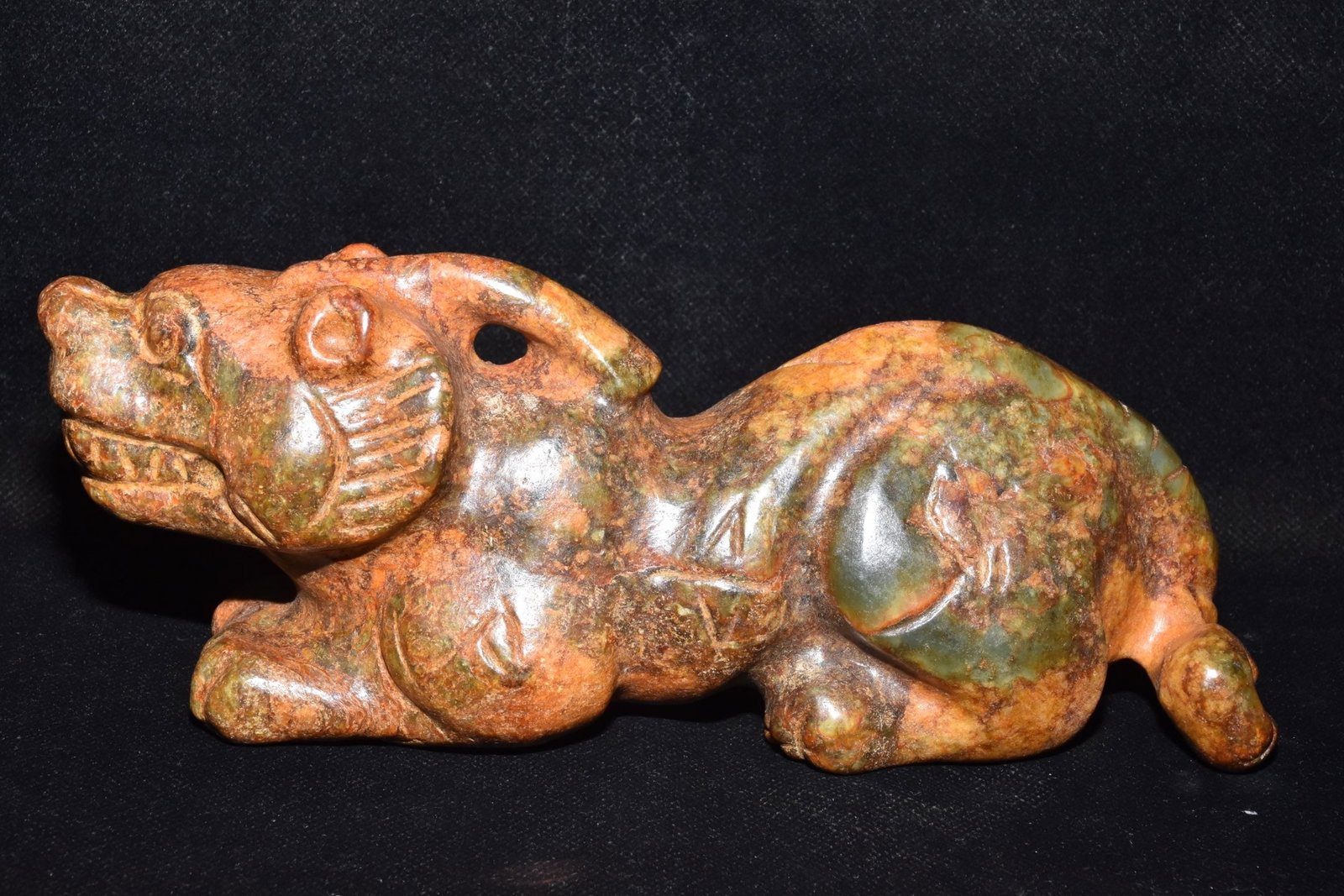 An Exquisite Hemo Jade Auspicious Beast Ornament (1 of 6)