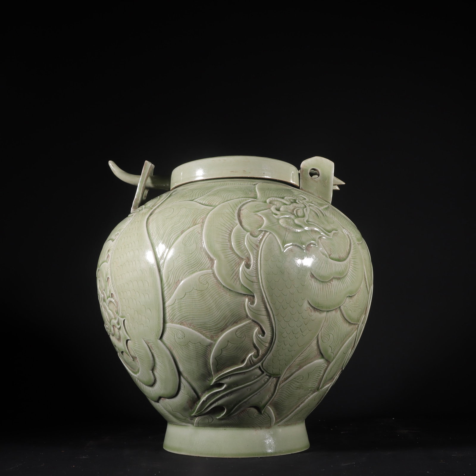 An Exquisite Yue yao Celadon Jar: An Exquisite Yue yao Celadon Jar Tang Dynasty, China Size:11.6inx11in越窑秘色青瓷摩羯纹锁罐 中国唐代 Size:29.5