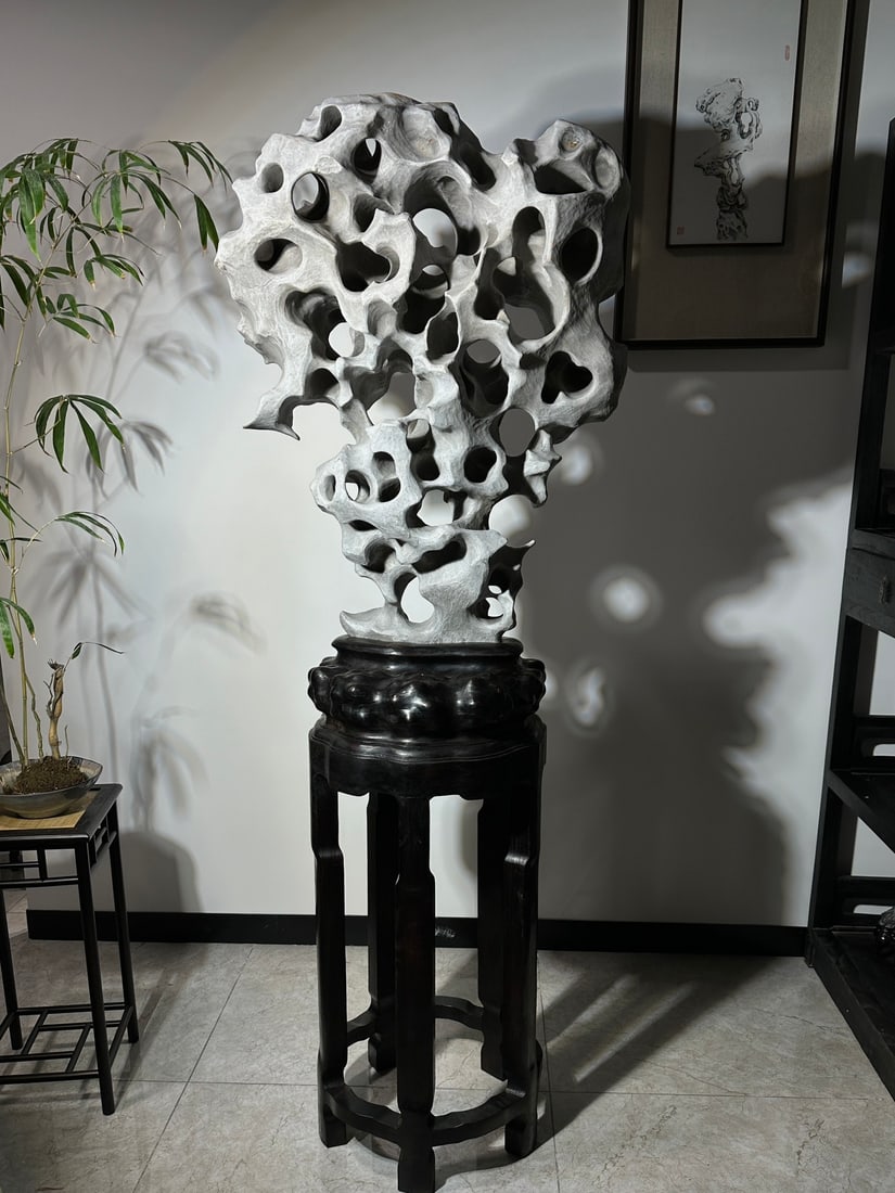 An Exquisite Taihu Stone Ornament: An Exquisite Taihu Stone Ornament Qing Dynasty, China Size:75.6inx28.3inx18.1in太湖石摆件 中国清代 Size:192cmx72cmx46cm