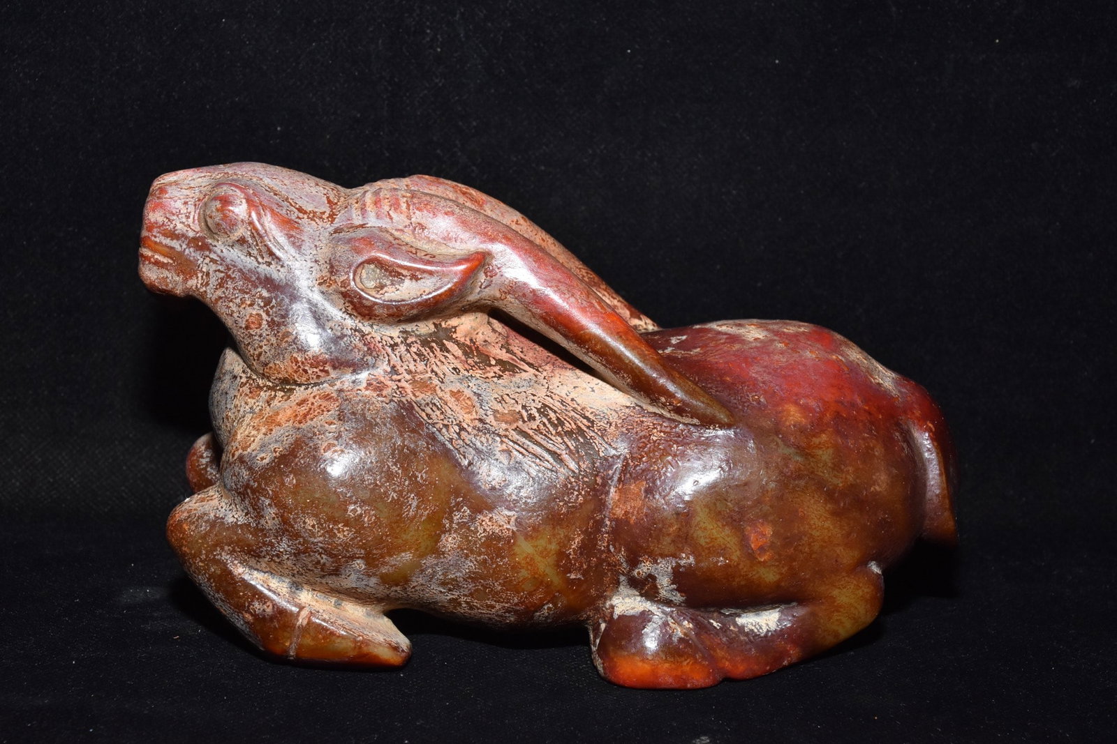 An Exquisite Hemo Jade Buffalo Ornament: An Exquisite Hemo Jade Buffalo Ornament Hong Shan Culture Size:4.3inx7.1in Weight:1.78kg河磨玉牛摆件 红山文化 Size:11cmx18cm Weight:1.78kg
