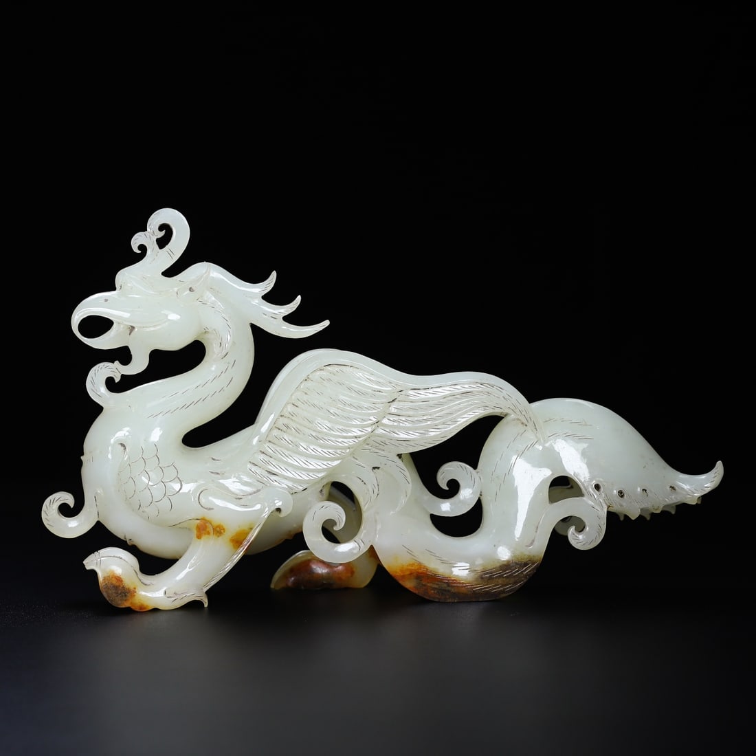 An Exquisite White Jade Phoenix Ornament: An Exquisite White Jade Phoenix Ornament Han Dynasty, China Size:10.4inx6inx2.4in Weight:1.004kg白玉凤鸟 中国汉代 Size:26.4cmx15.2cmx6.1cm