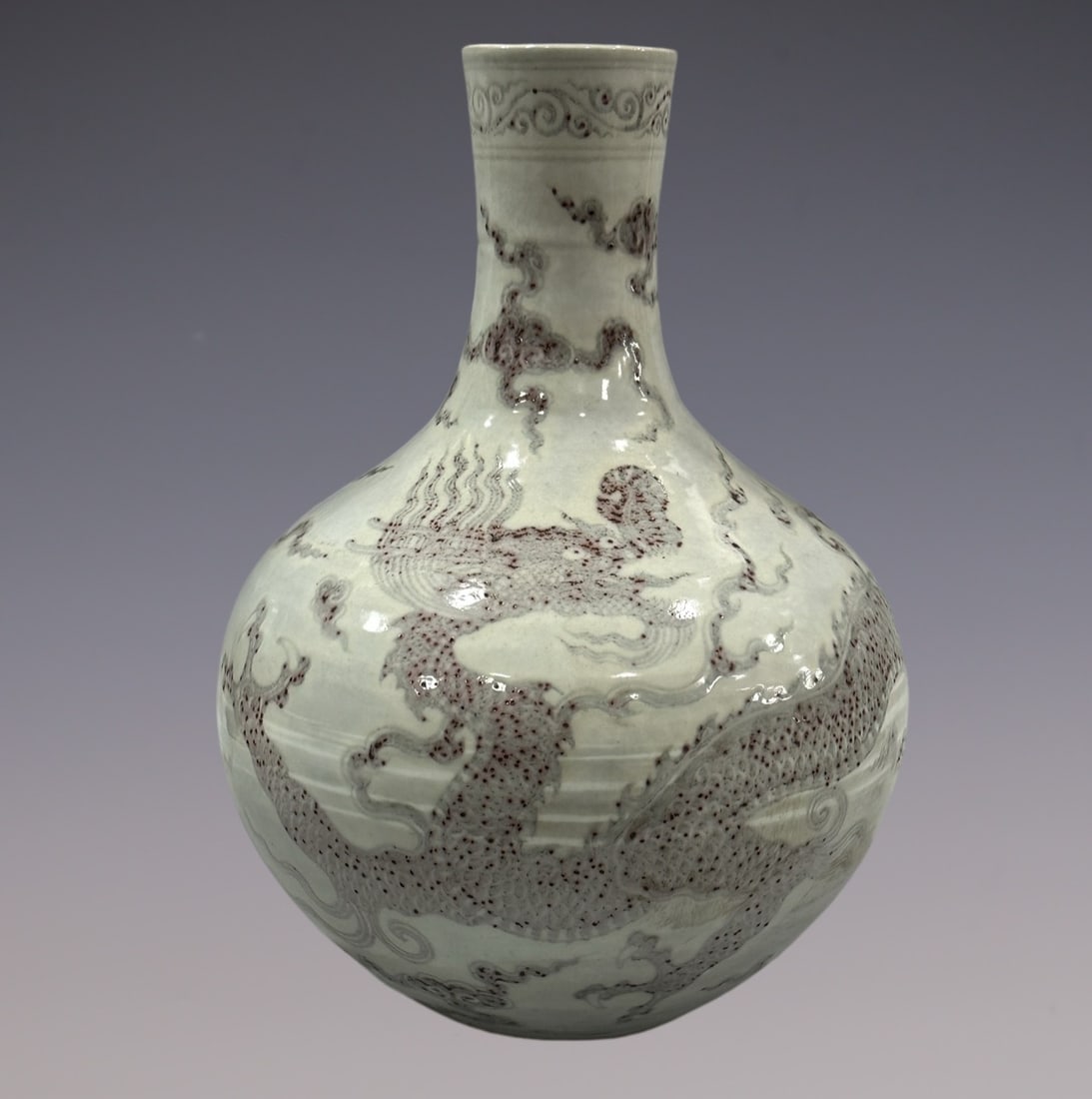 An Exquisite Chai yao Underglaze-Red Dragon Pattern Vase: An Exquisite Chai yao Underglaze-Red Dragon Pattern Vase Ming Dynasty, China Size:17.5in柴窑釉里红龙纹天球瓶 中国明代