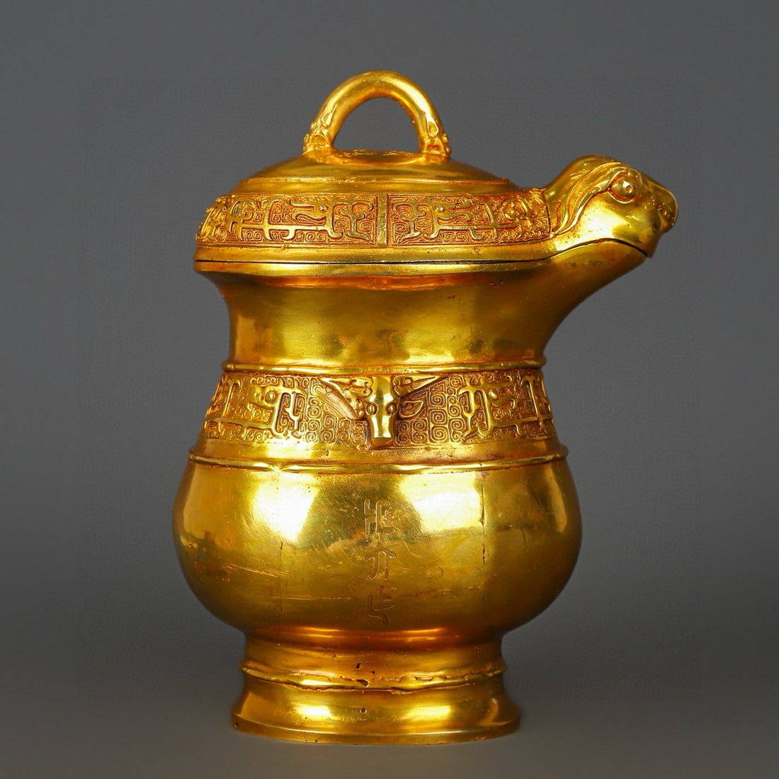 An Exquisite Gilt Bronze Beast-Face Pattern Jar: An Exquisite Gilt Bronze Beast-Face Pattern Jar Han Dynasty, China Size:7.1inx10.2in Weight:1950g铜鎏金器皿 中国汉代 Size:18cmx26cm Weight:1950g