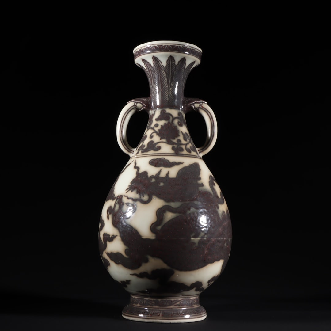 An Exquisite Underglaze-Red Dragon Pattern Lotus Pattern Double-Ears Vase: An Exquisite Underglaze-Red Dragon Pattern Lotus Pattern Double-Ears Vase Ming Dynasty, China Size:16.1inx7.9in釉里红龙纹双耳瓶
