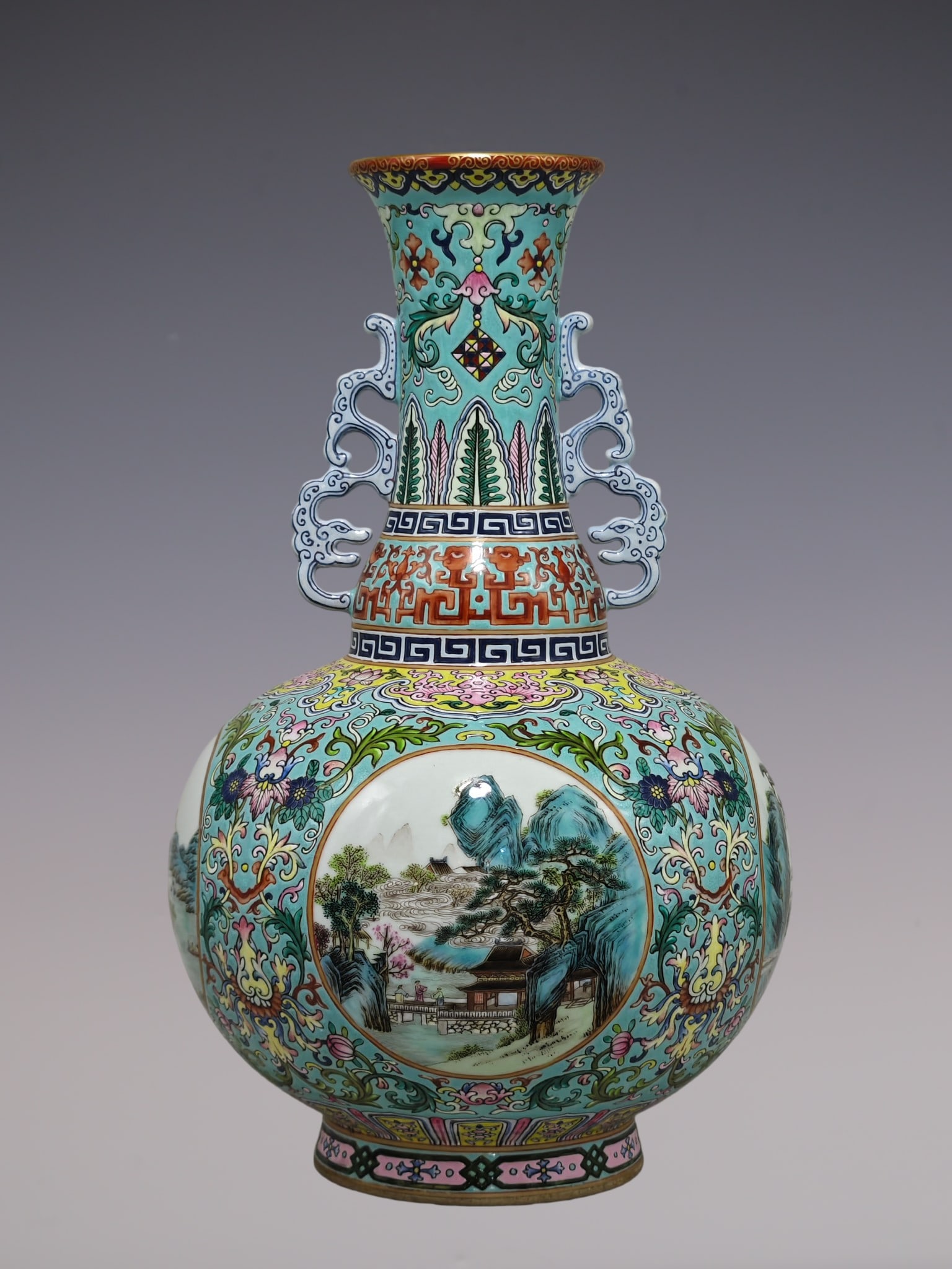 An Exquisite Famille-Rose Green Ground Lotus Pattern Landscape and Figure Pattern Double-Ears Vase: An Exquisite Famille-Rose Green Ground Lotus Pattern Landscape and Figure Pattern Double-Ears Vase Qing Dynasty, China Qianlong Six-character Mark