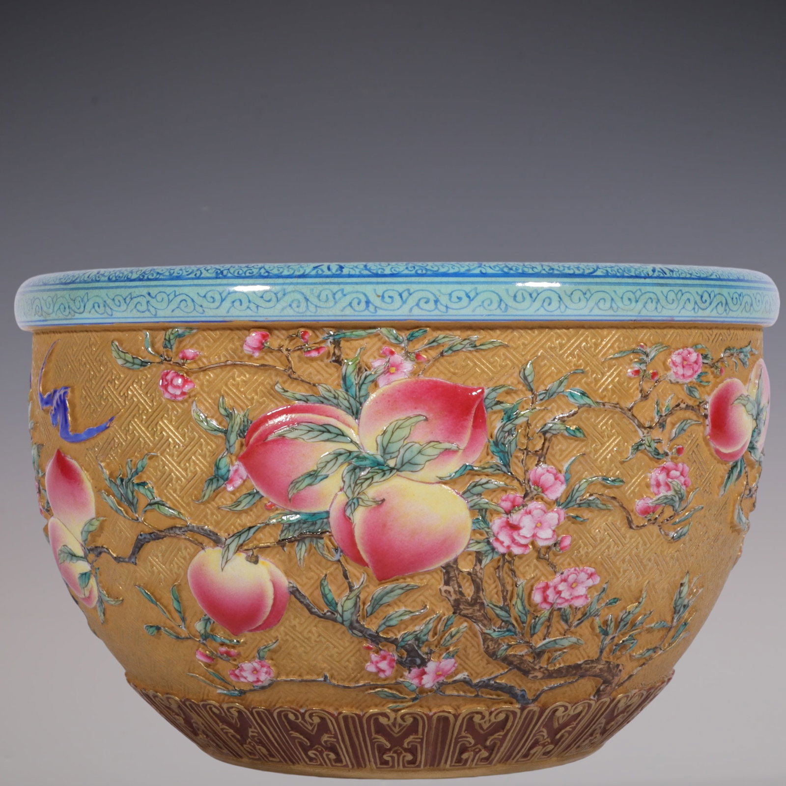 An Exquisite Enamel Bats and Peach Pattern Brush Washer: An Exquisite Enamel Bats and Peach Pattern Brush Washer Qing Dynasty, China Qianlong Six-character Mark Size:3.9inx6.1in珐琅彩雕刻金地九桃水